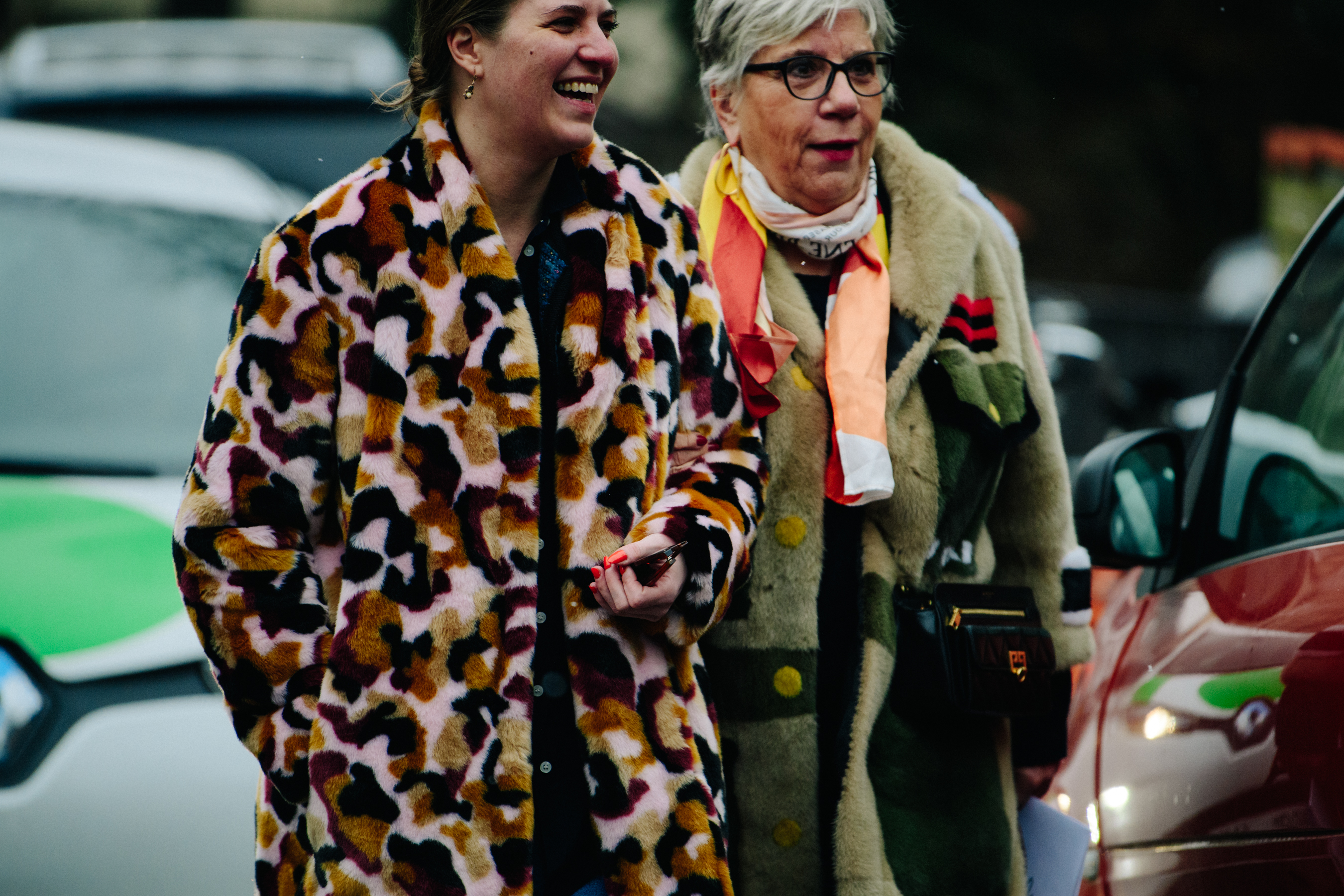 Two women wearing fur
