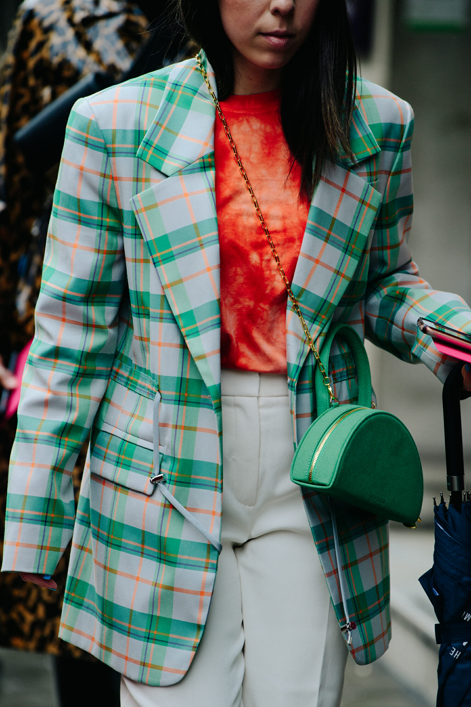 Woman carrying green bag