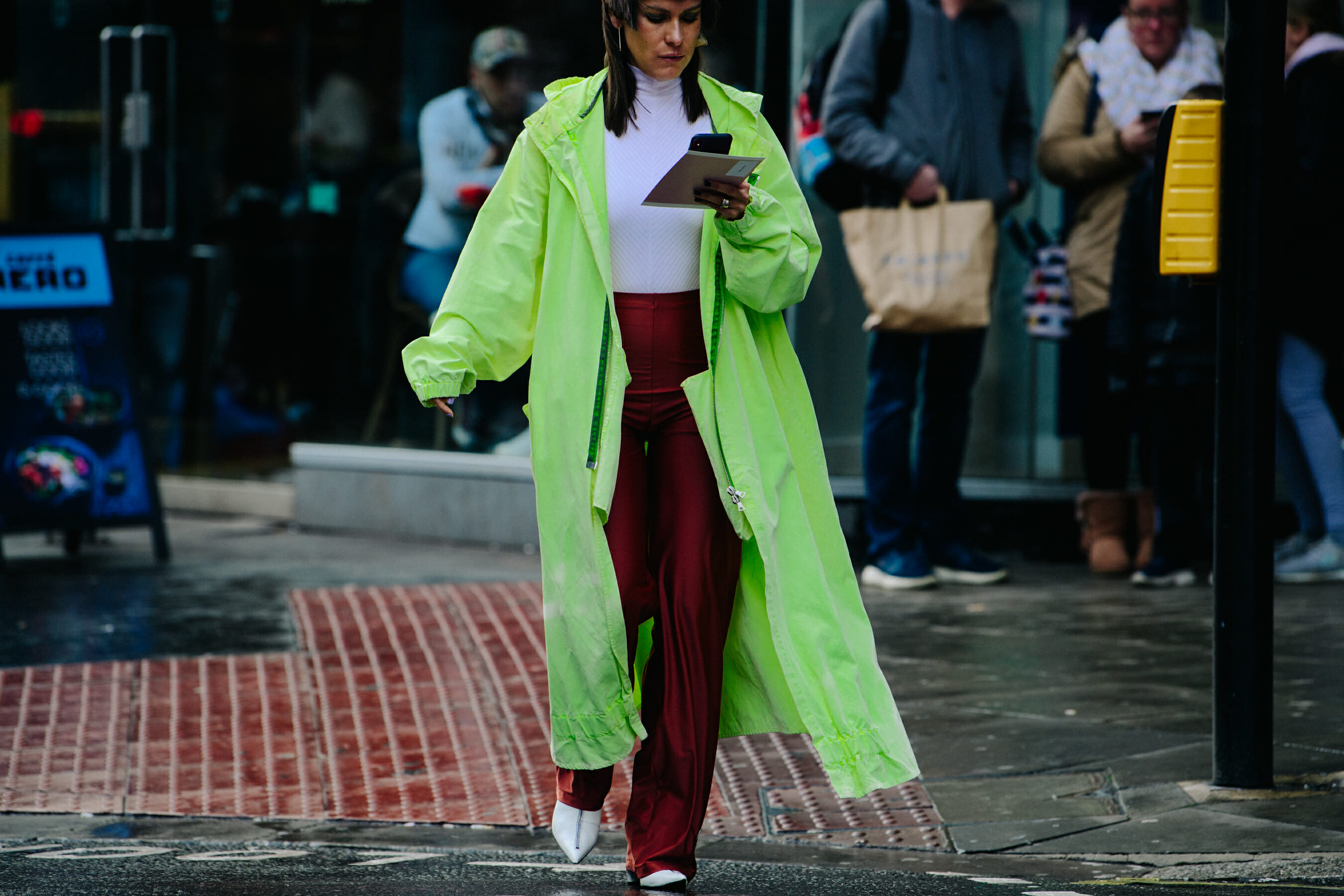 Woman wearing bright green coat