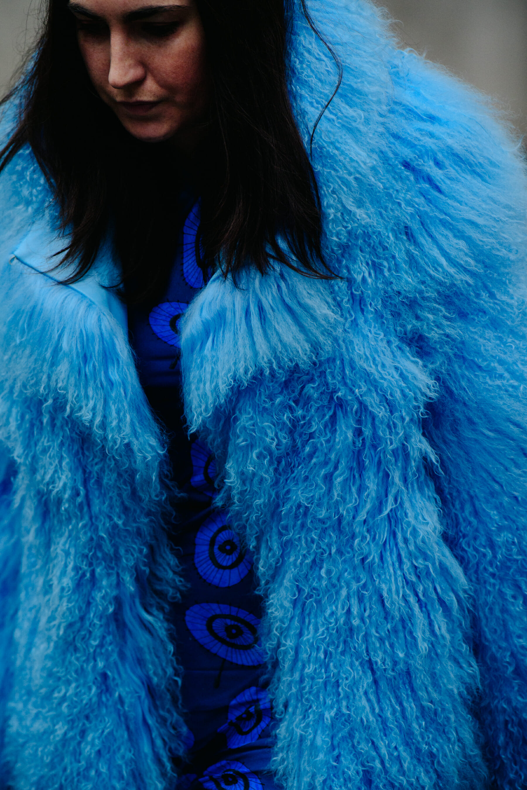Woman wearing blue fur coat