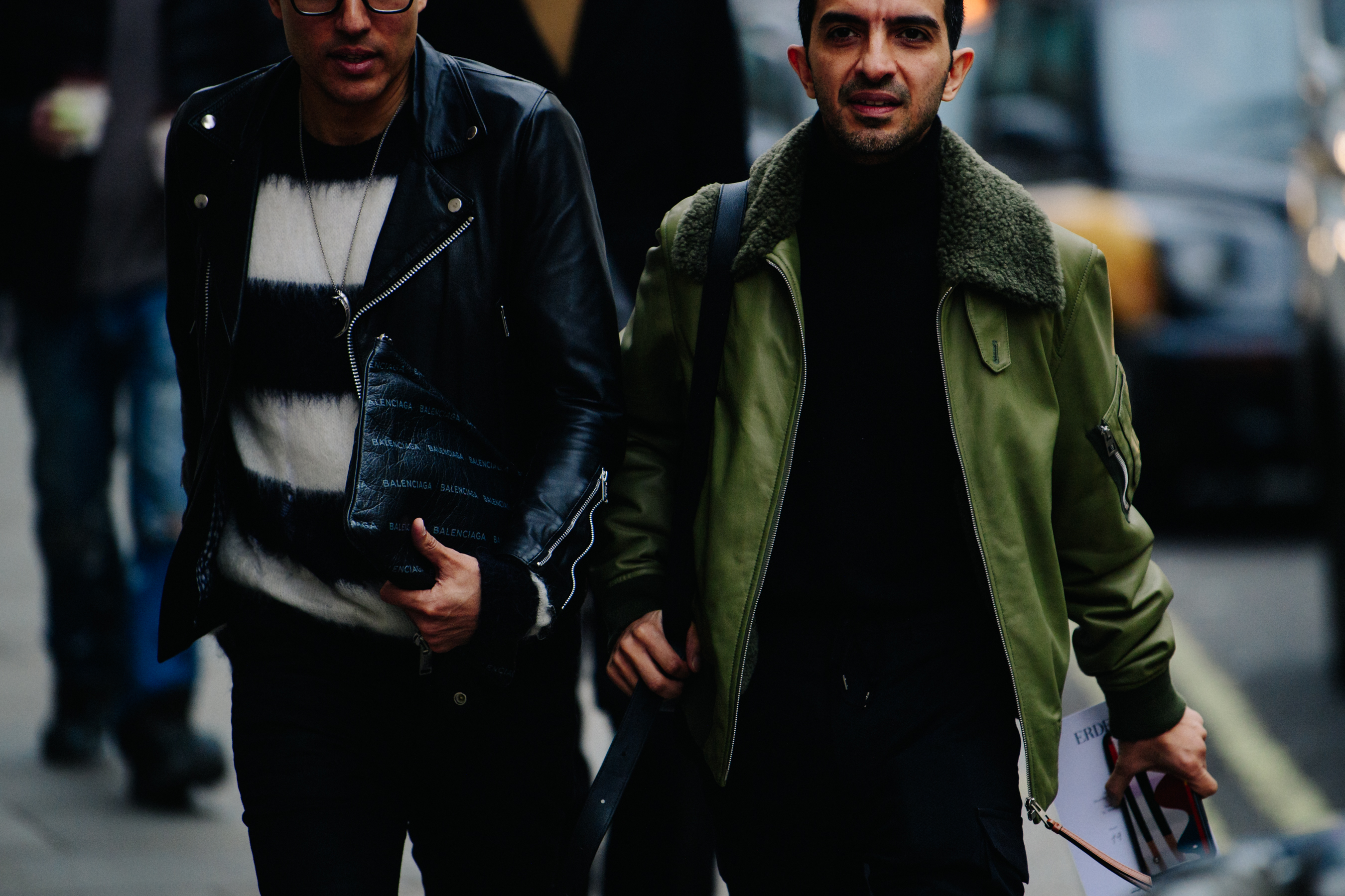 Two men wearing green and black