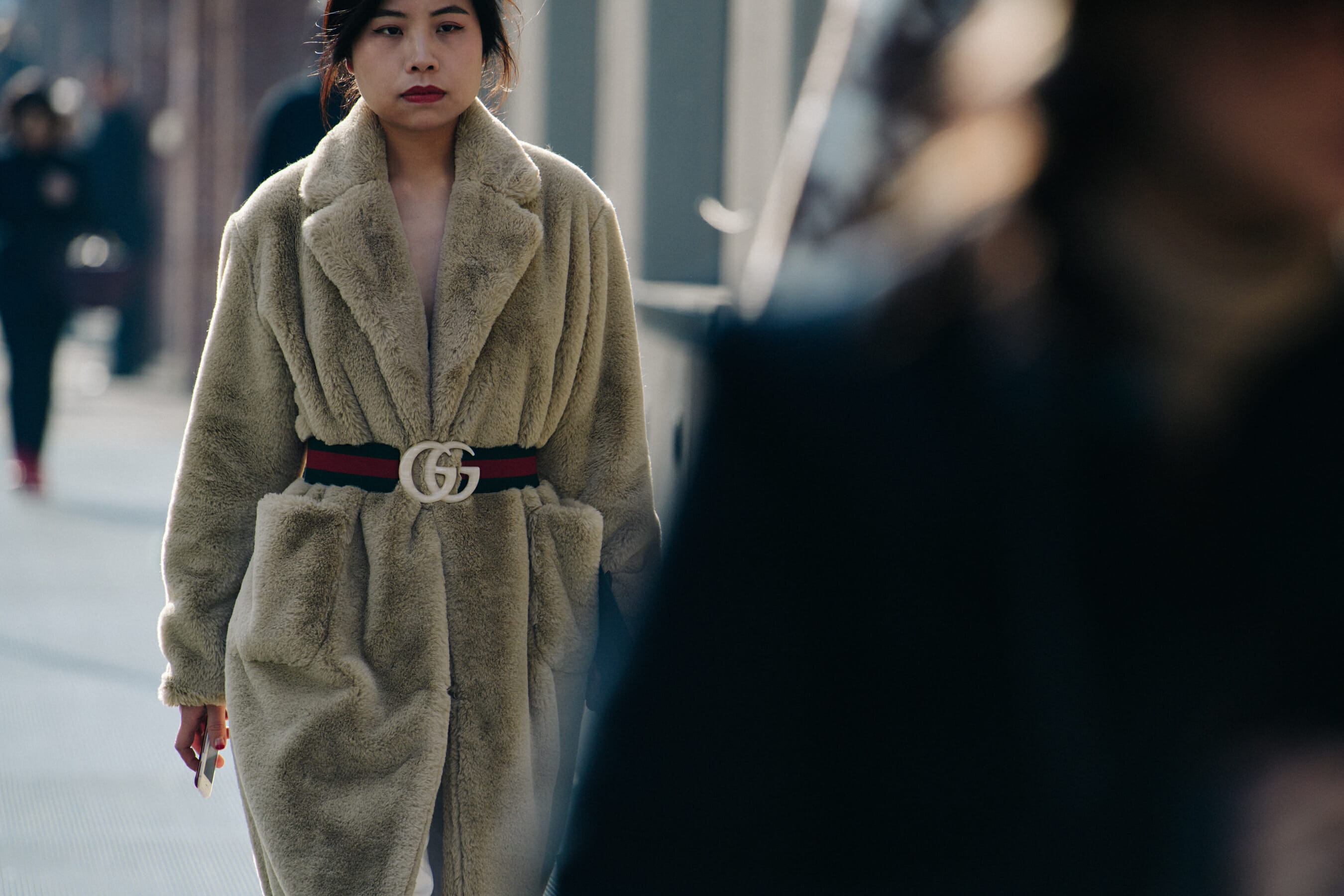 Woman wearing Gucci fur coat