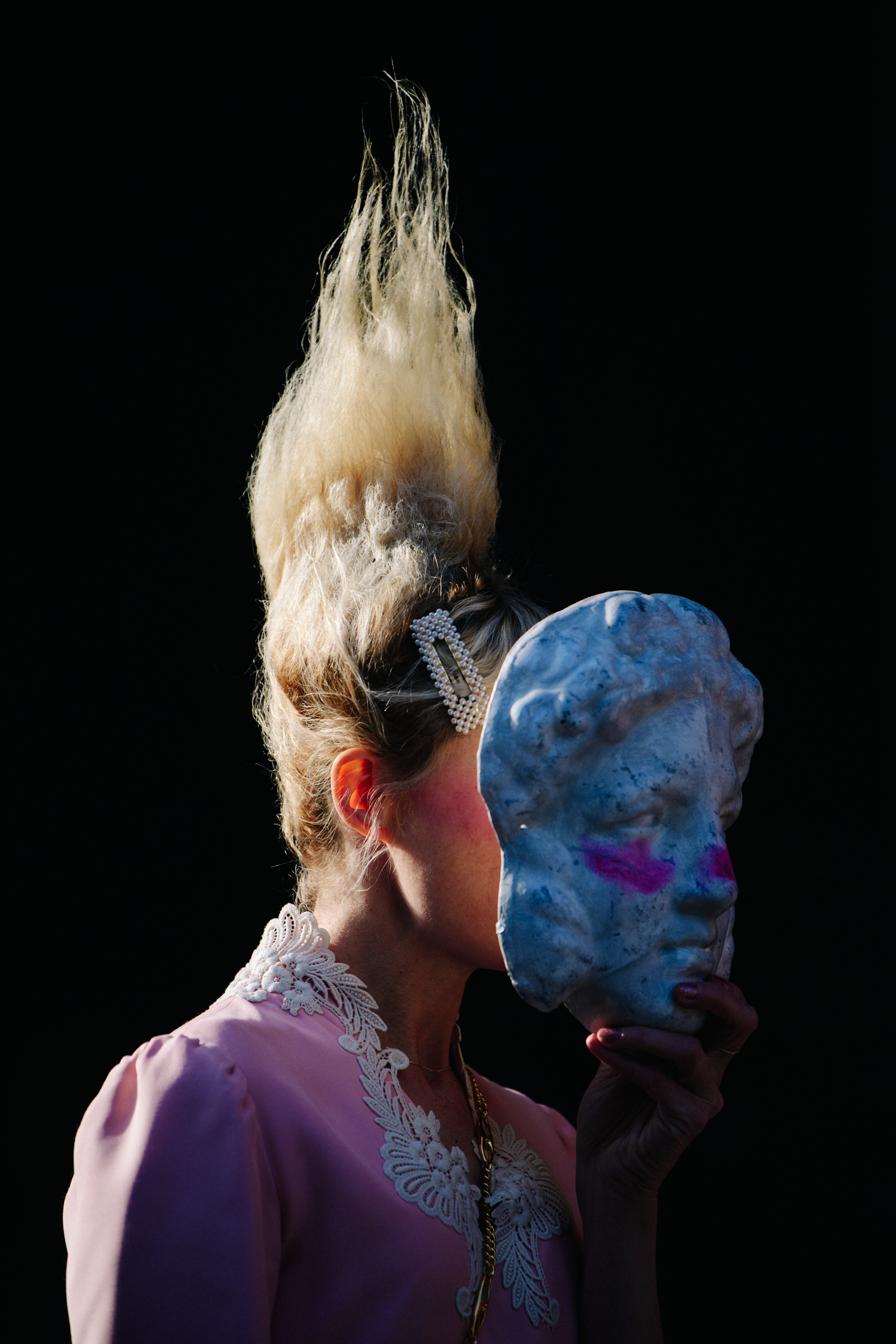 Woman wearing stone face mask