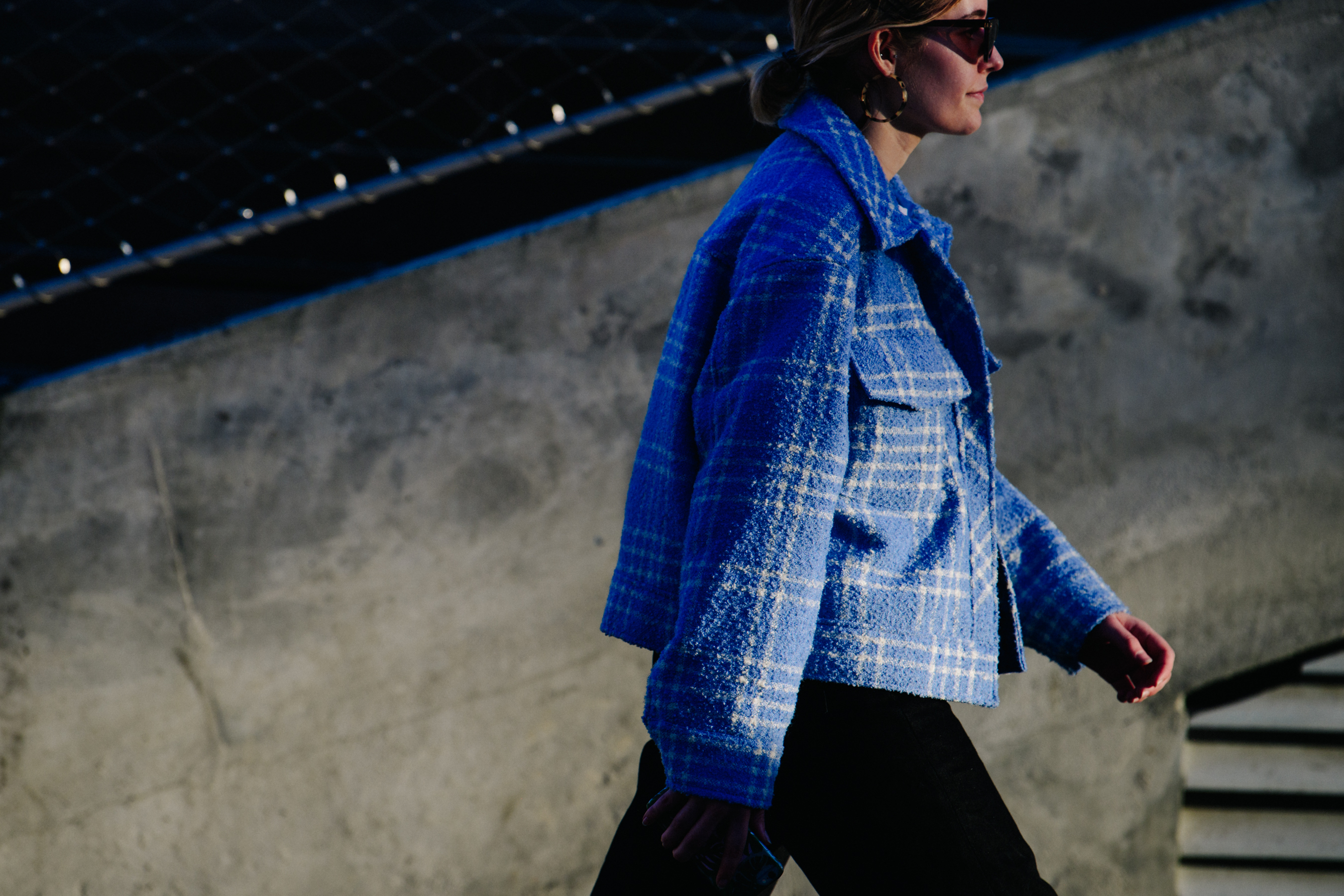 Woman wearing cropped blue jacket