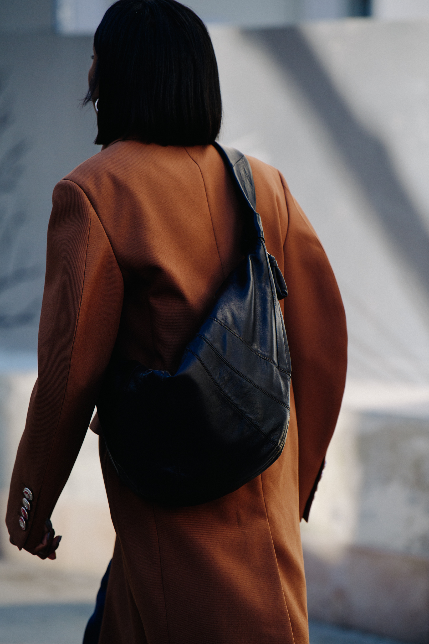 Woman carrying brown leather bag