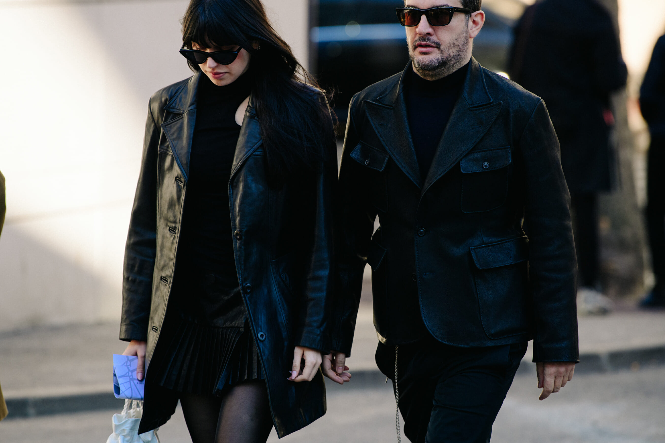 Couple wearing black leather outfits