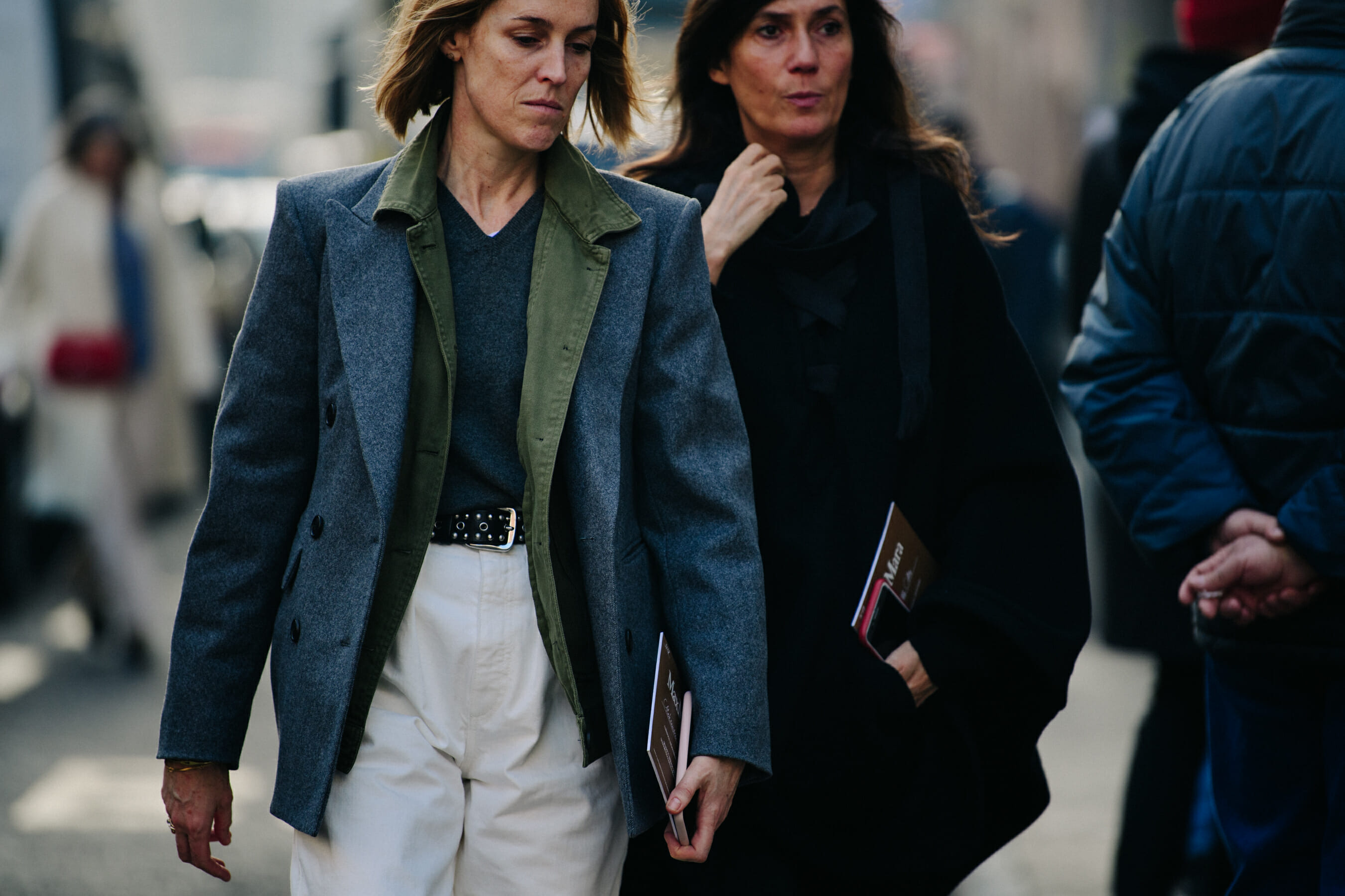 Two women wearing dark jackets