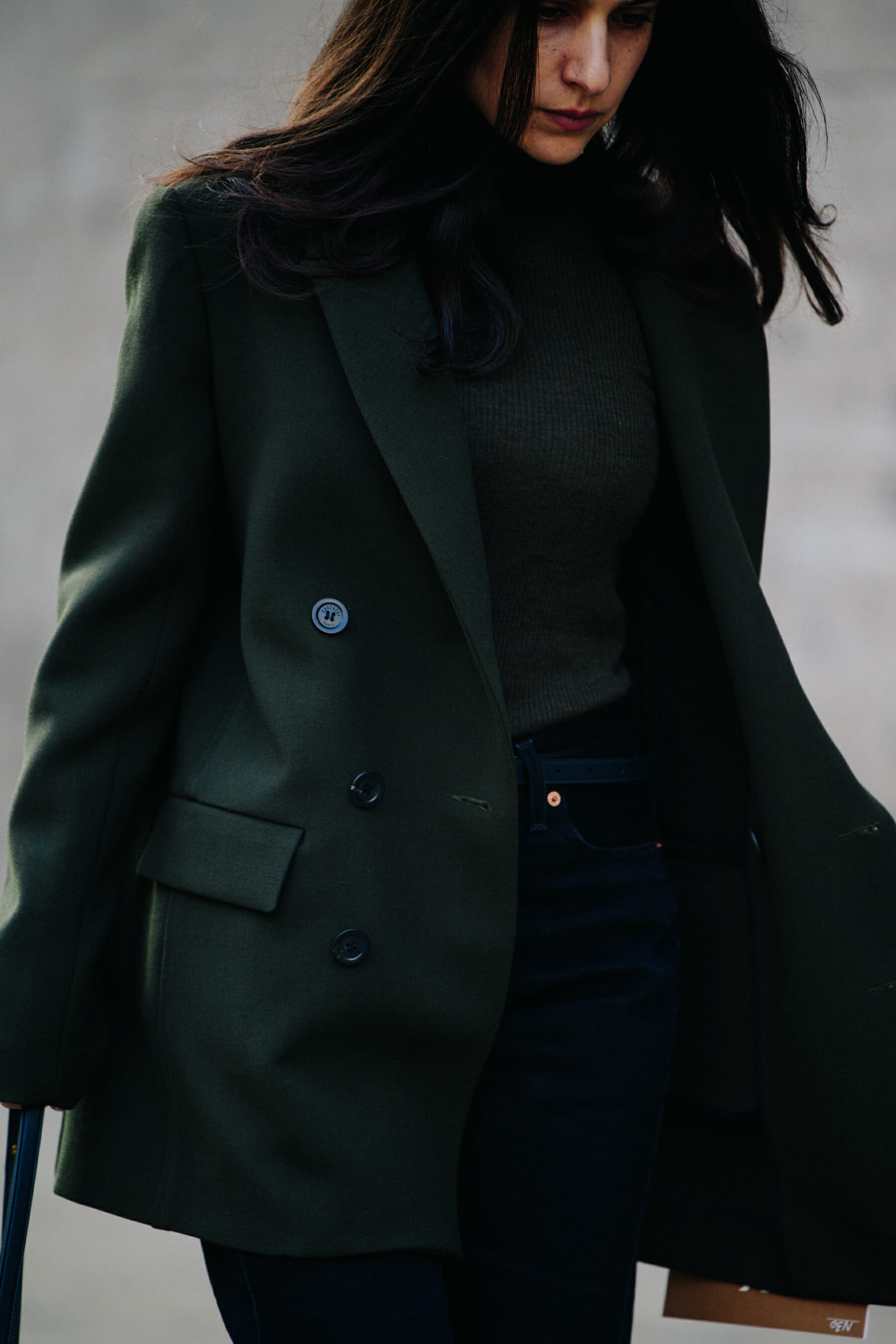 Woman wearing dark green wool coat