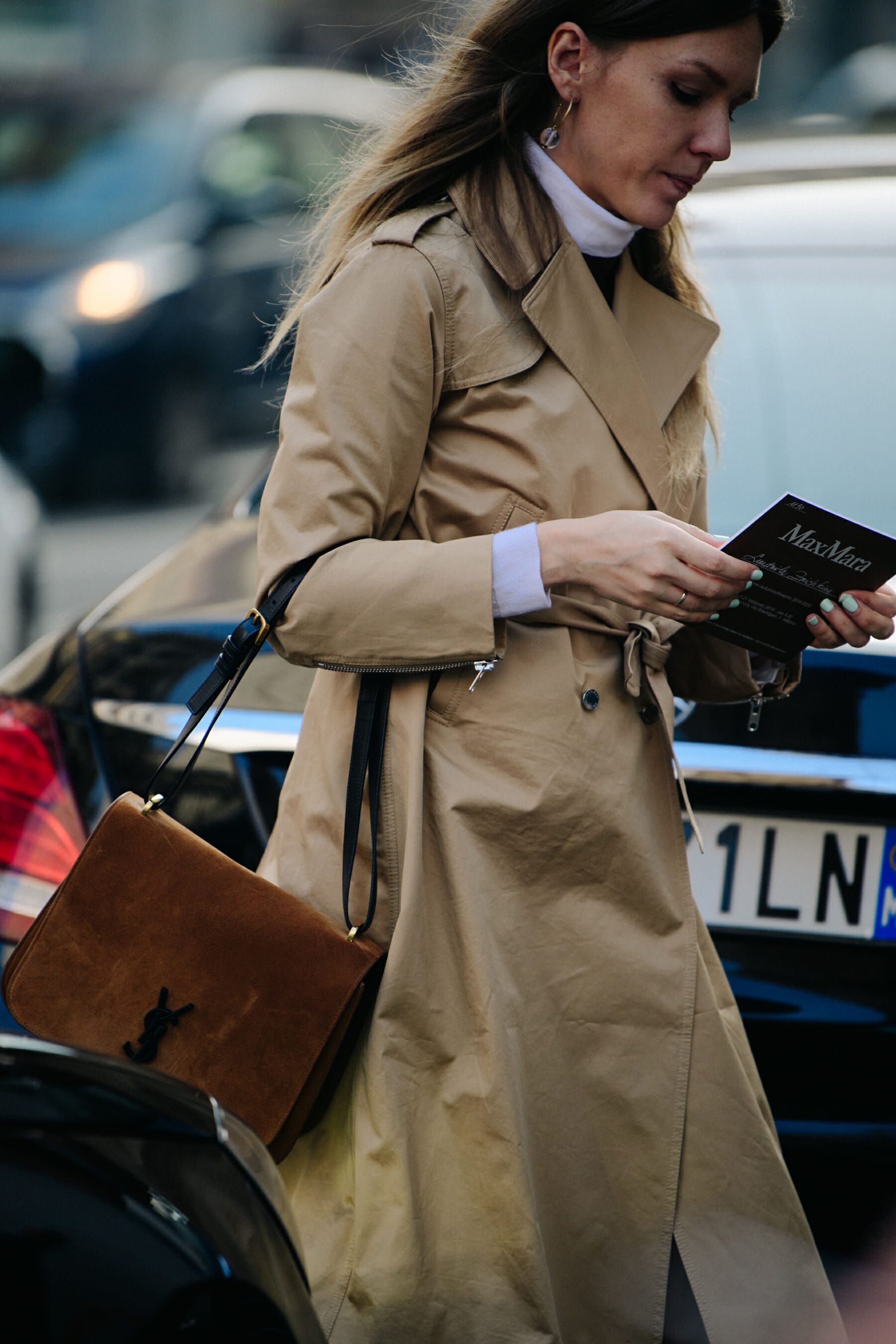 Woman wearing tan trench coat