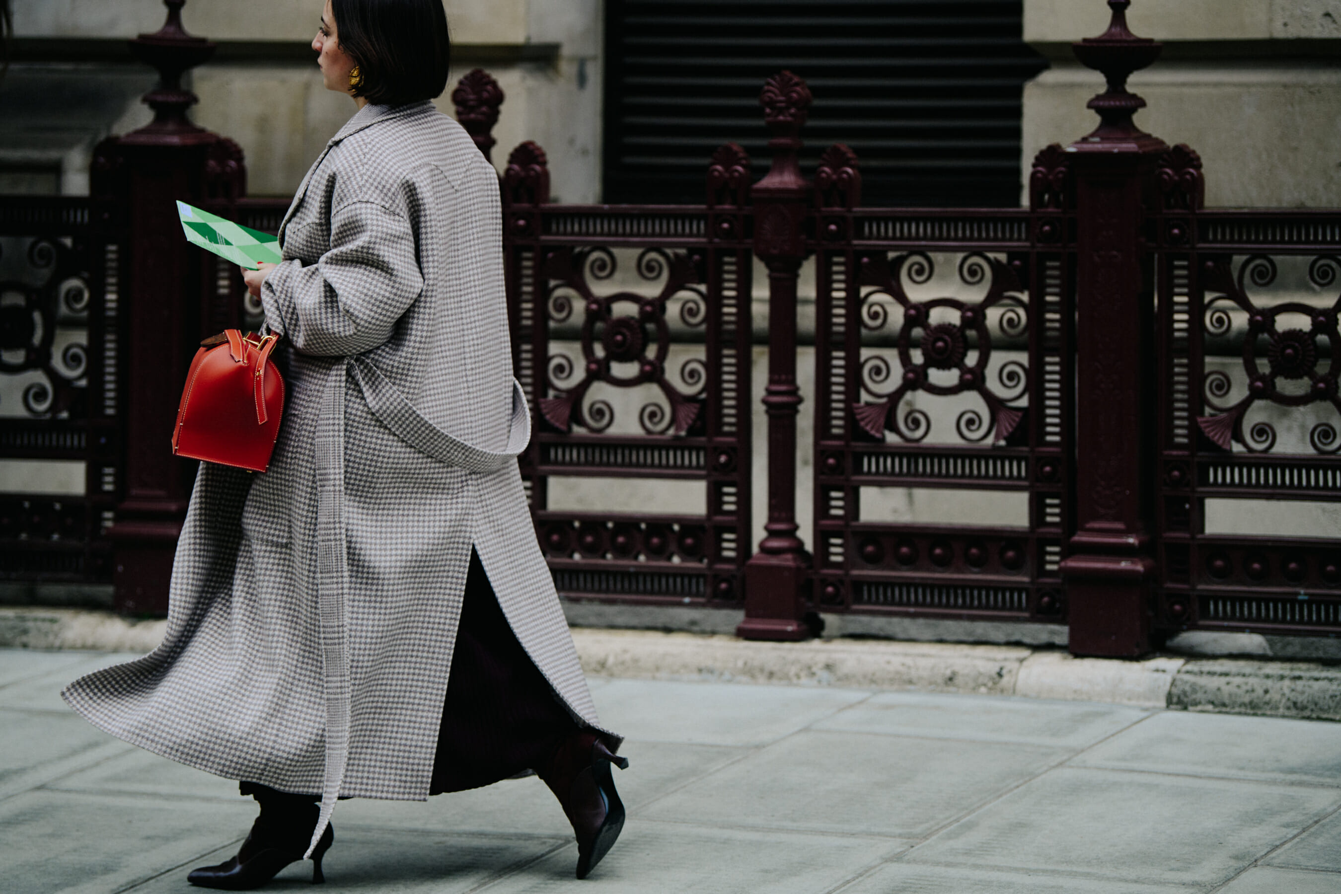 Woman carrying red leather bag