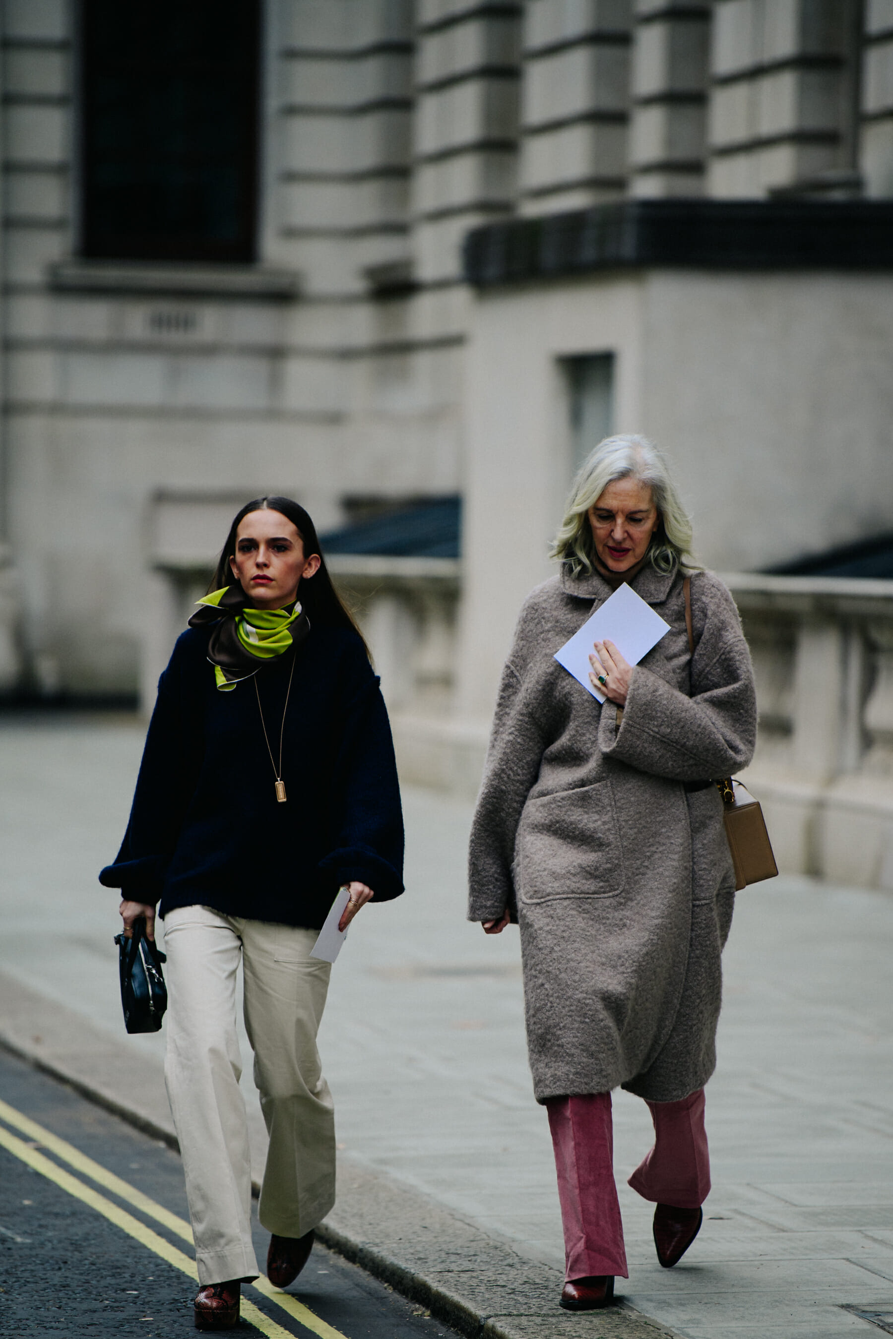 Two women wearing wool coats