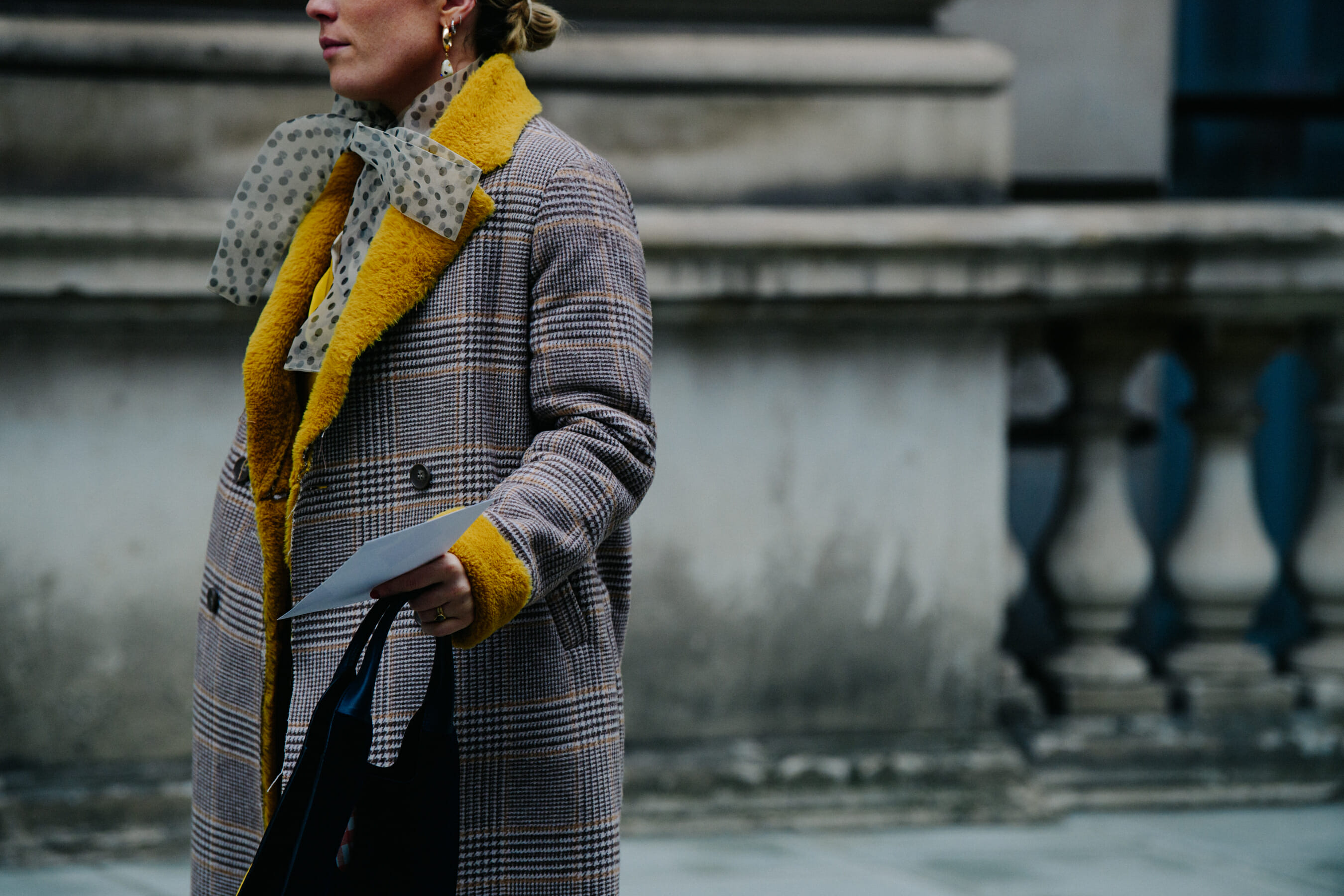 Woman wearing yellow fur trim