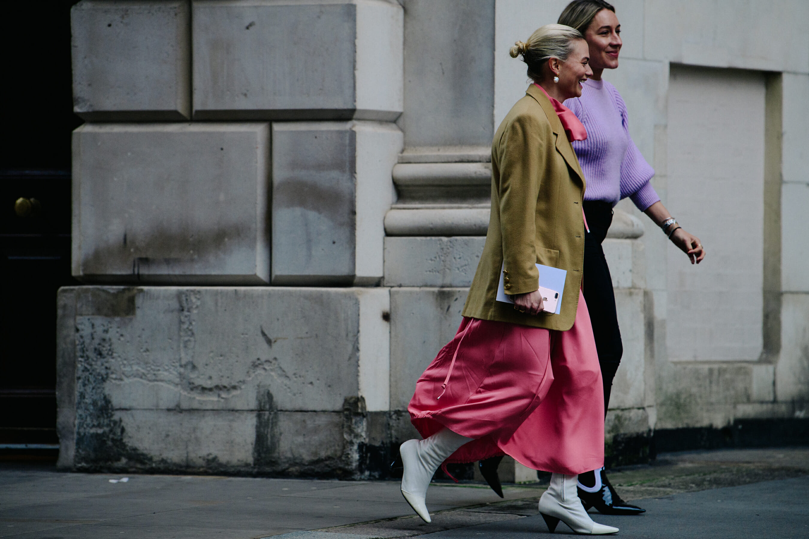 Two women wearing pink and purple clothes