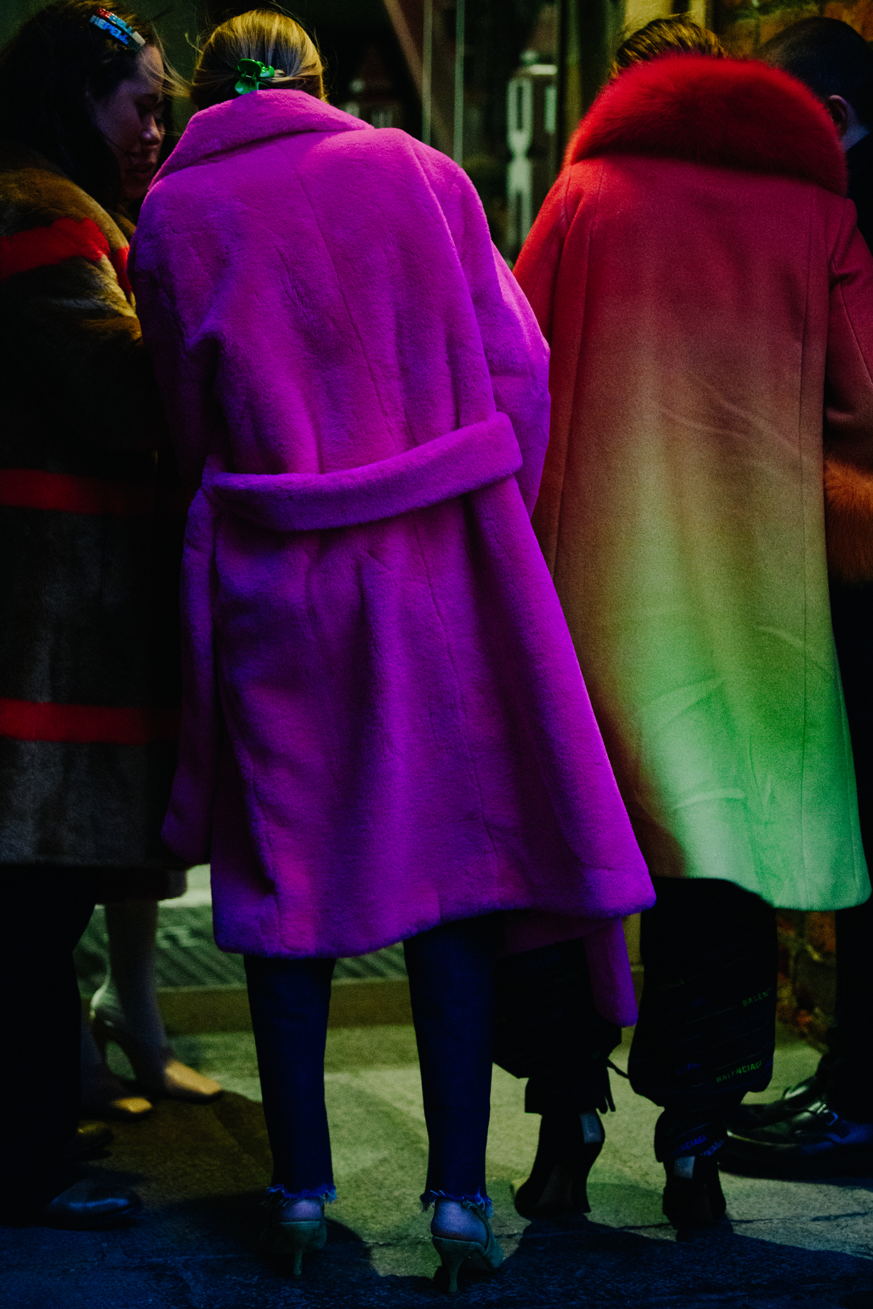 Two women wearing colourful coats