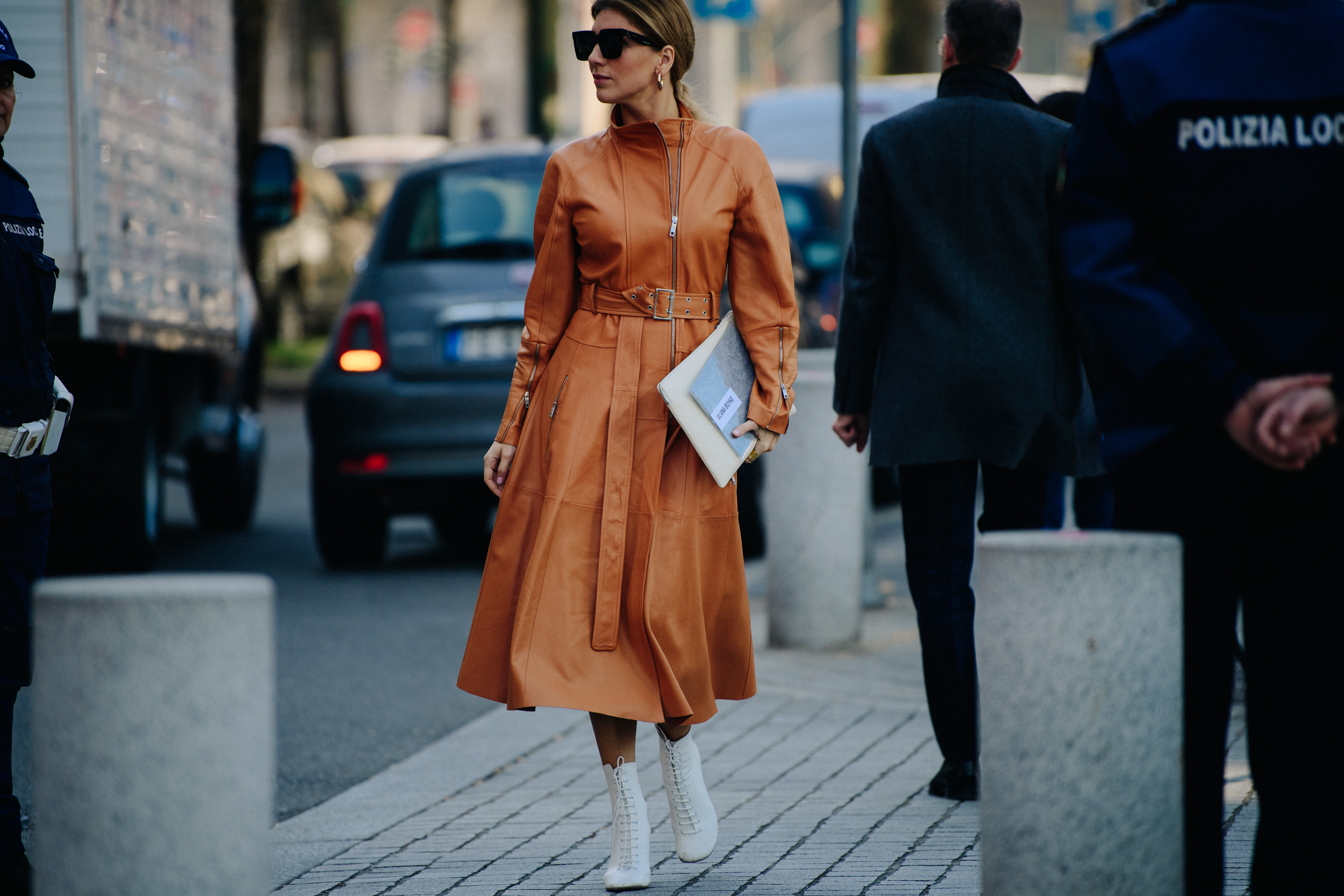 Woman wearing brown leather coat