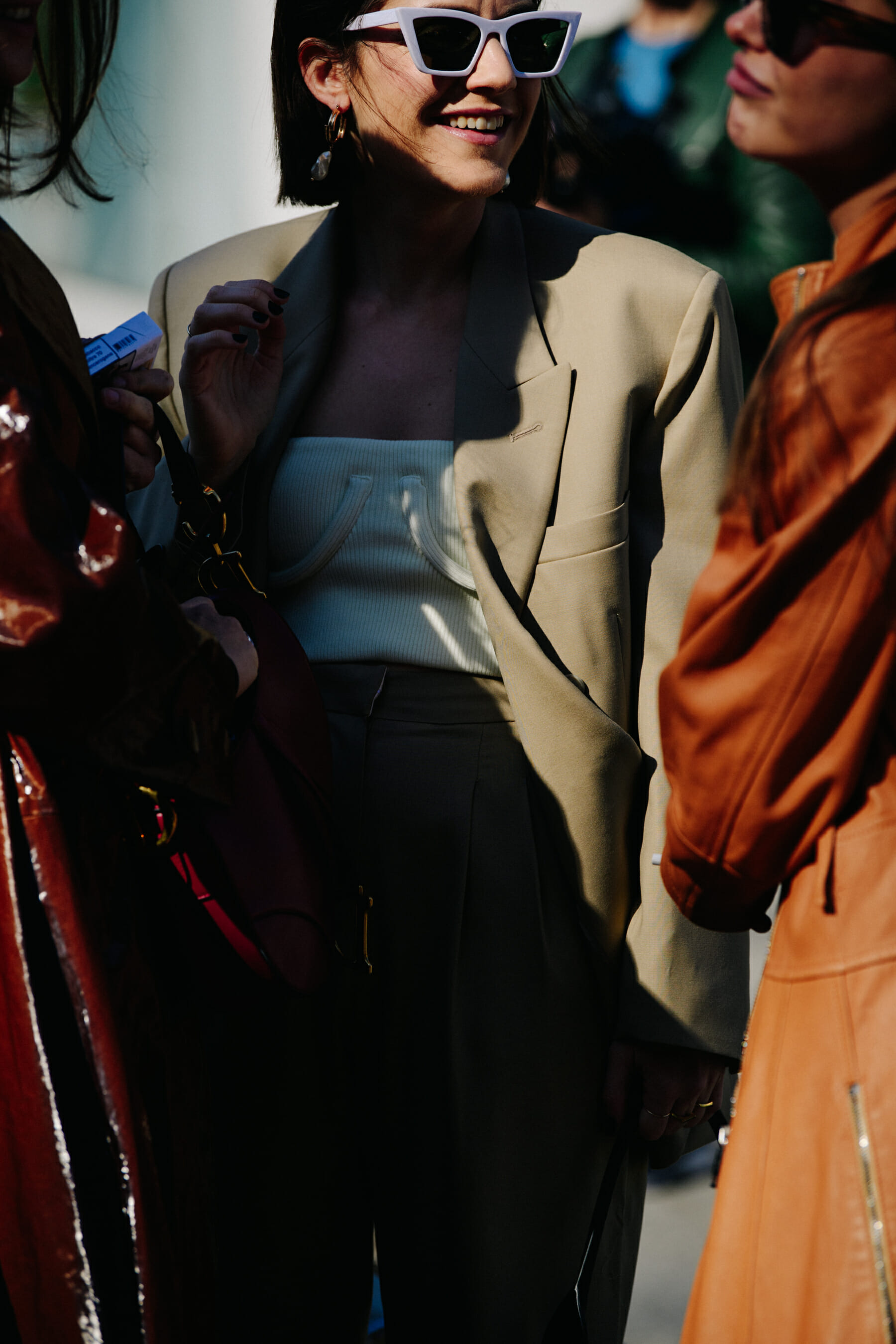 Woman wearing tan jacket