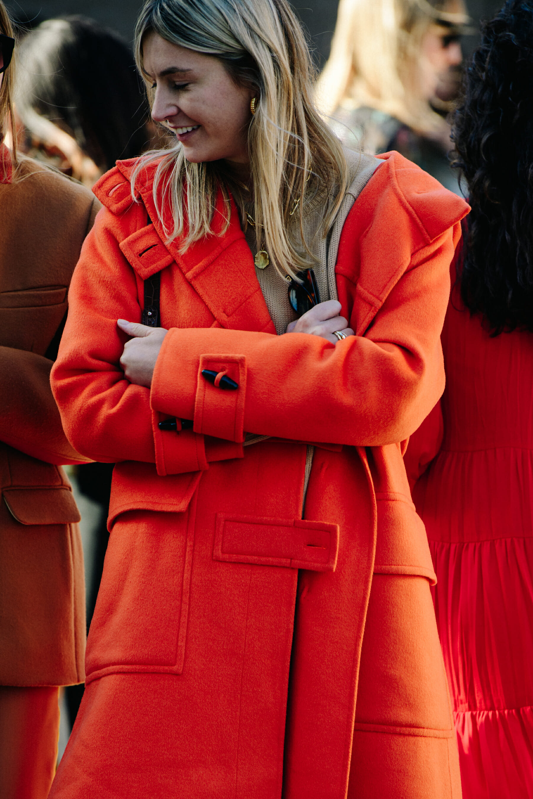 Woman wearing orange coat