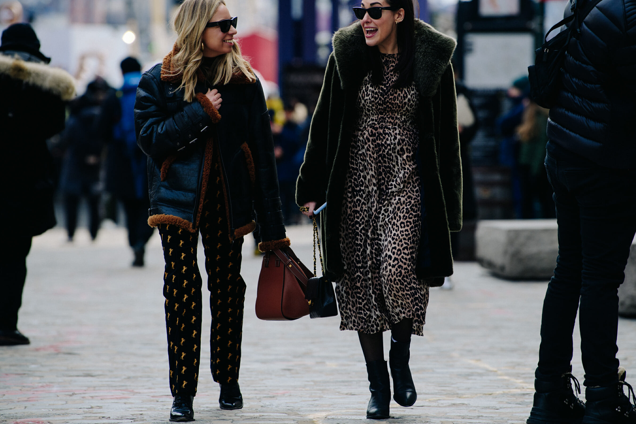 Two women wearing pattern outfits