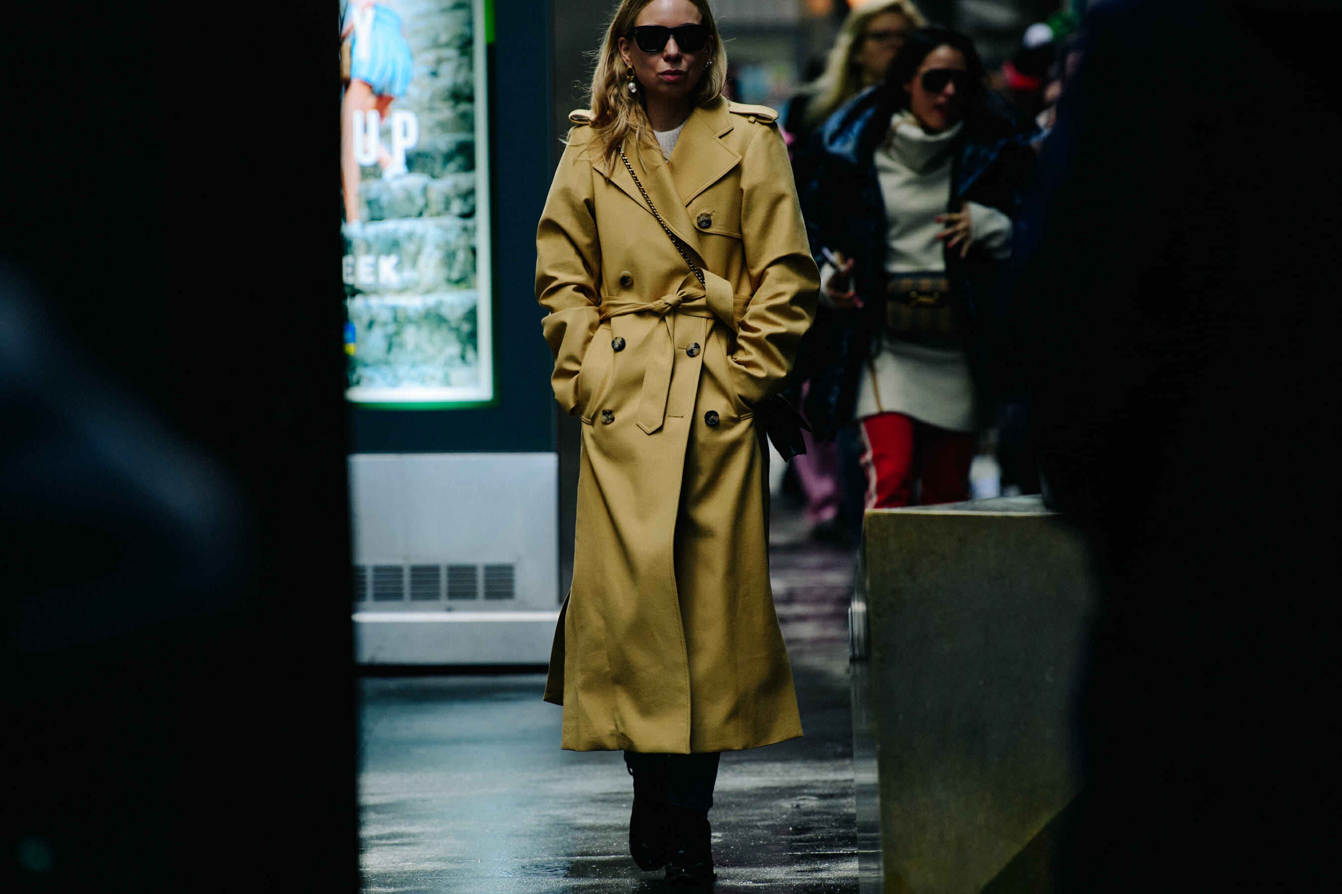 Woman wearing tan coat