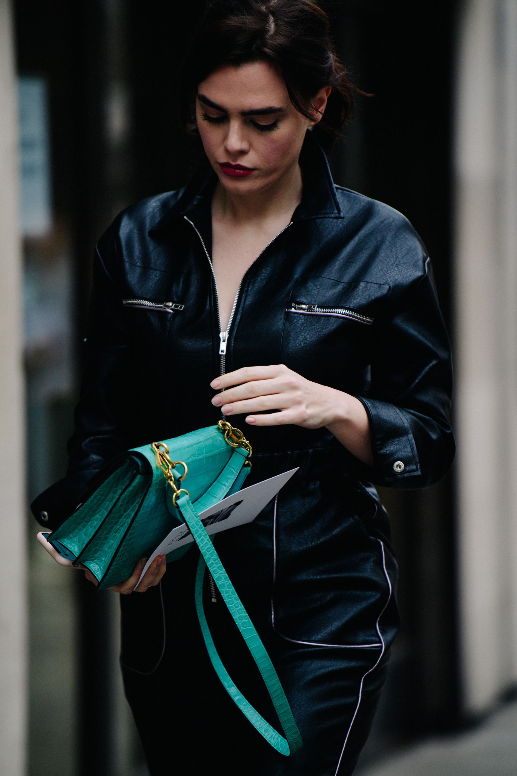 Woman wearing black leather jumpsuit