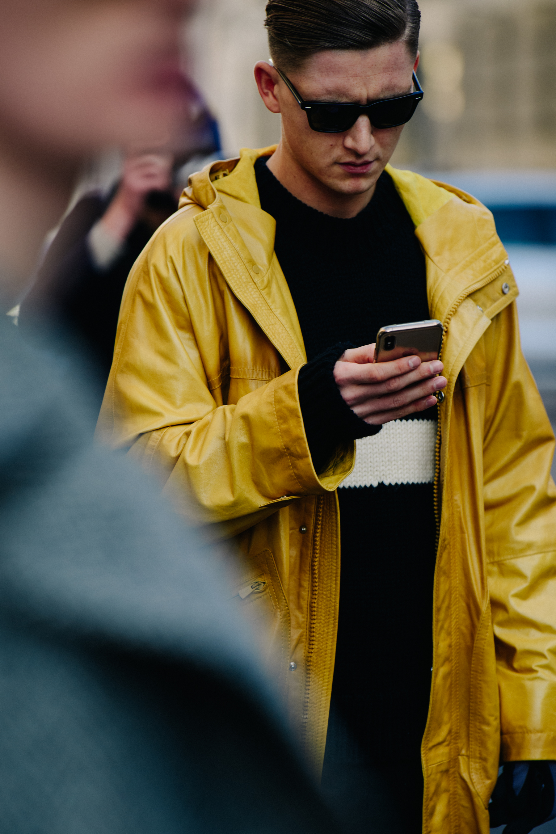 Man wearing yellow coat