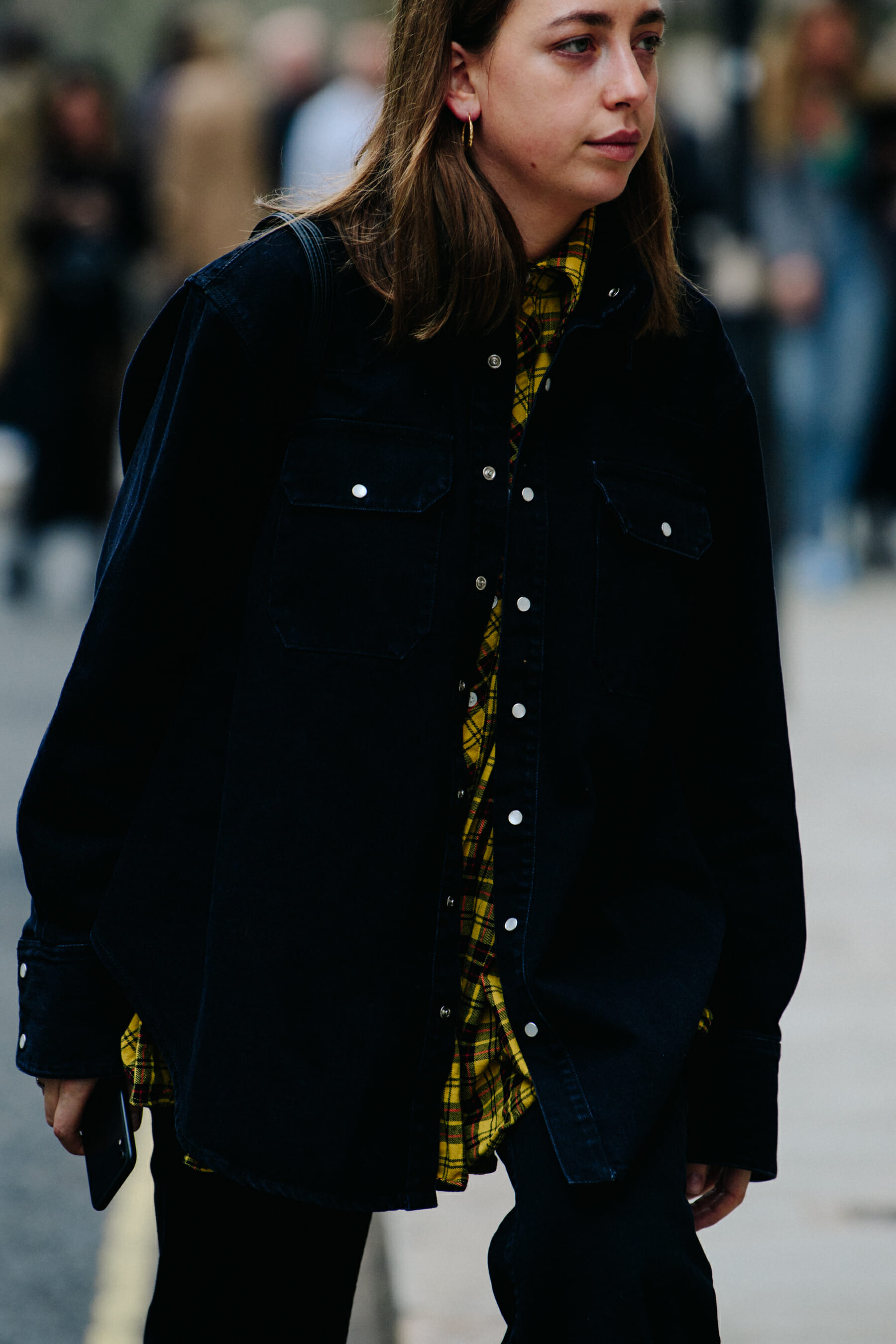 Woman wearing yellow check shirt