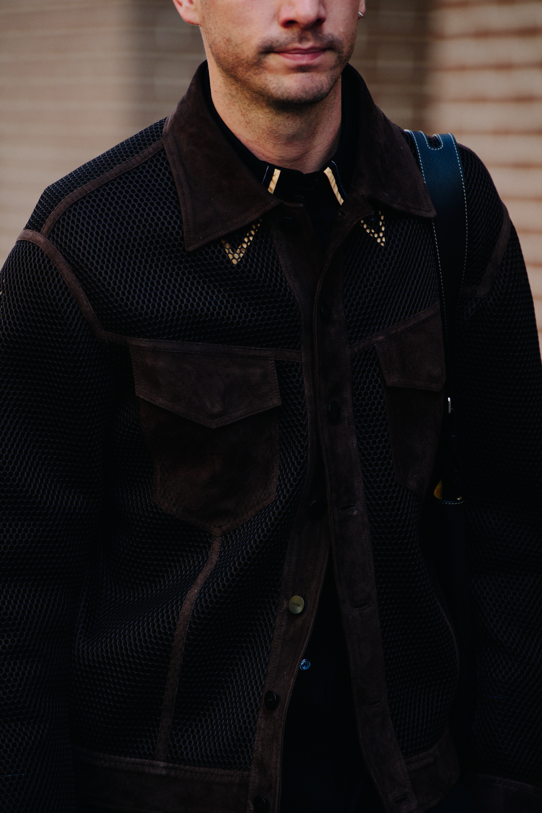 Man wearing brown mesh jacket