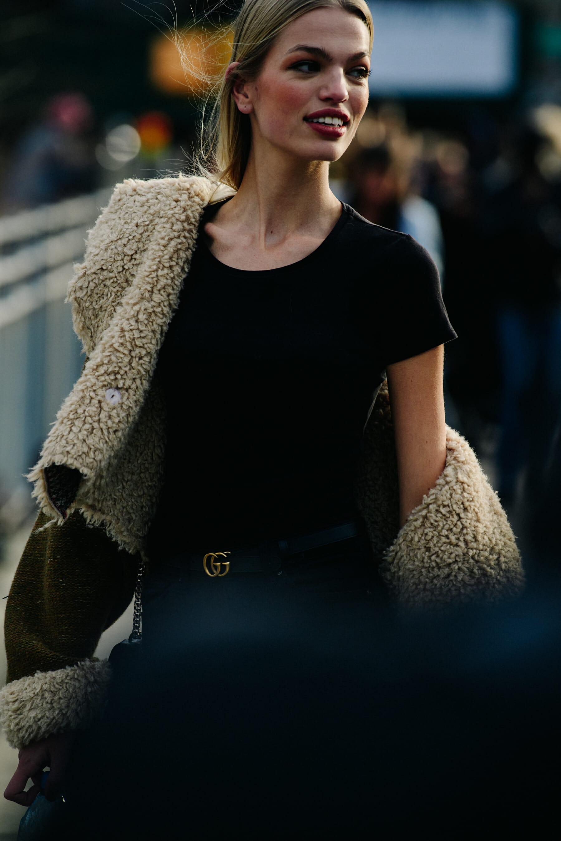 Model wearing black Gucci belt