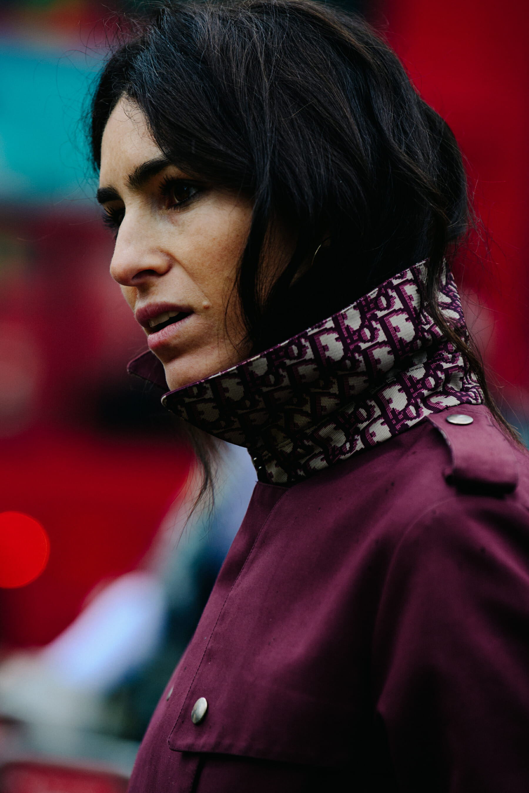 Woman wearing dark red coat