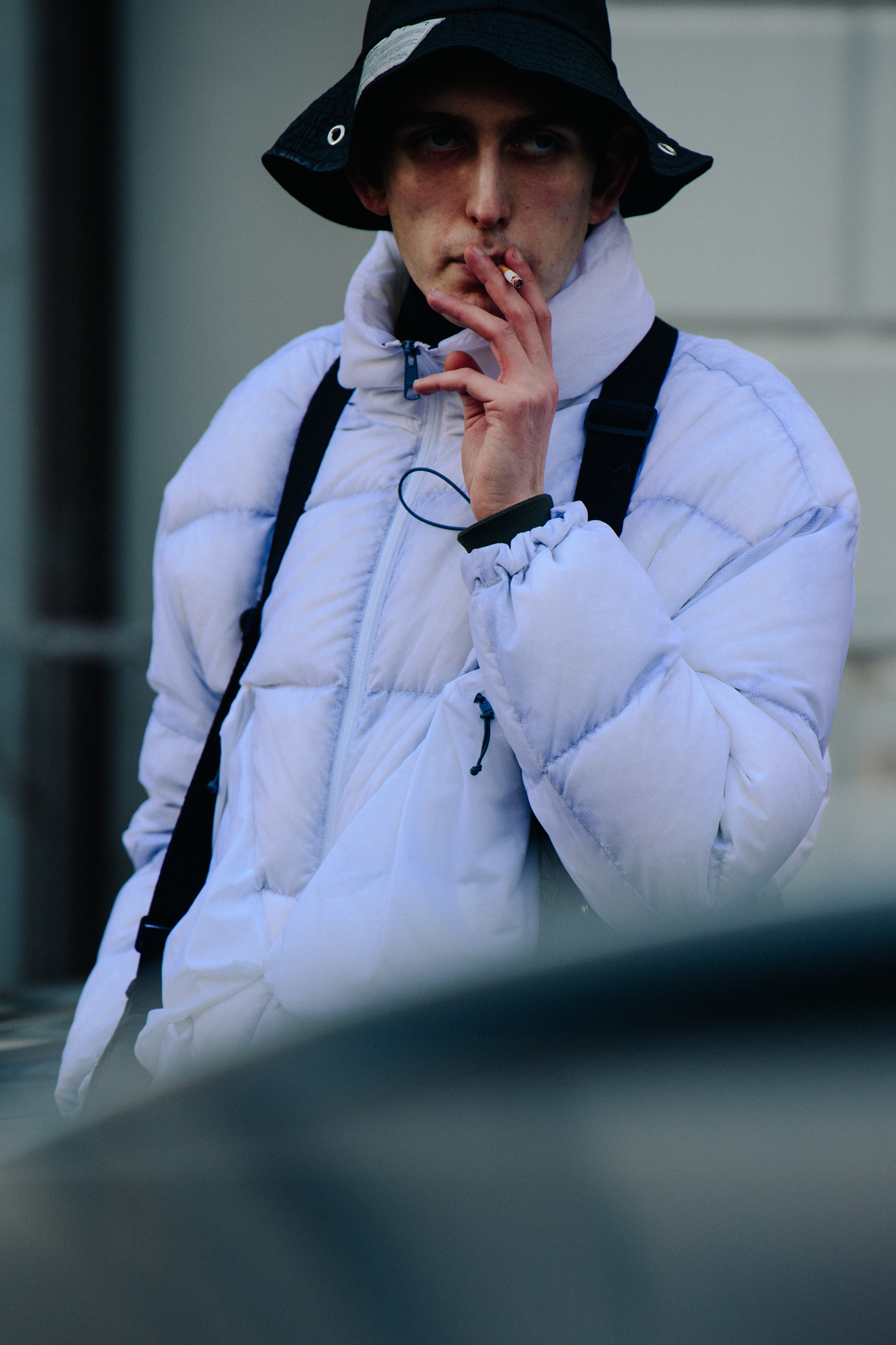 Man wearing white coat