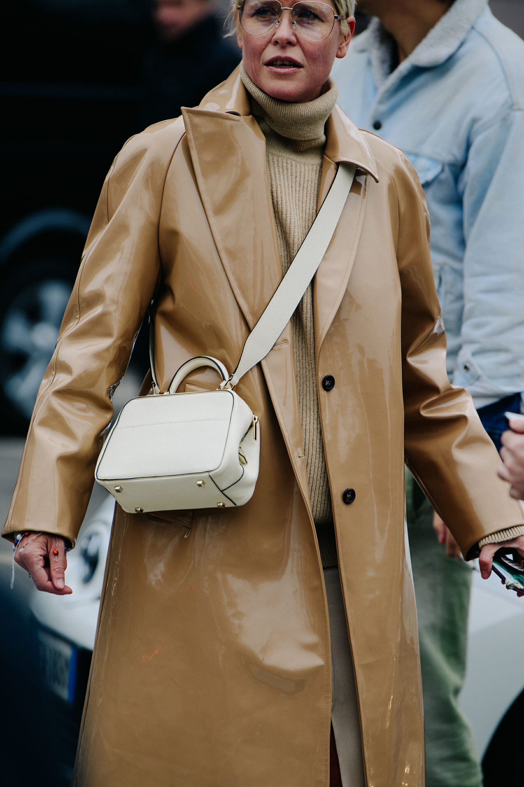 Woman wearing brown plastic coat