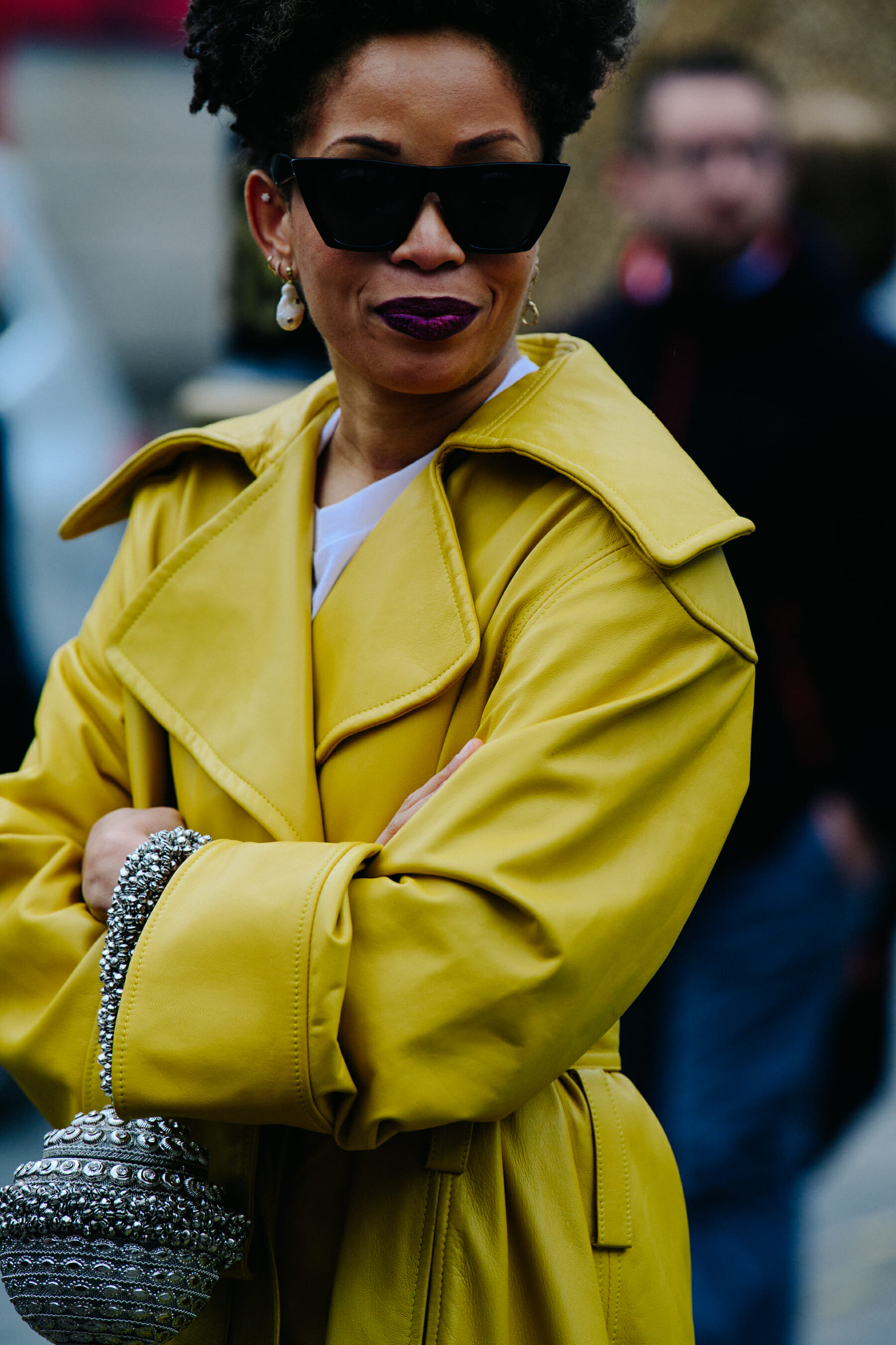 Woman wearing yellow leather coat