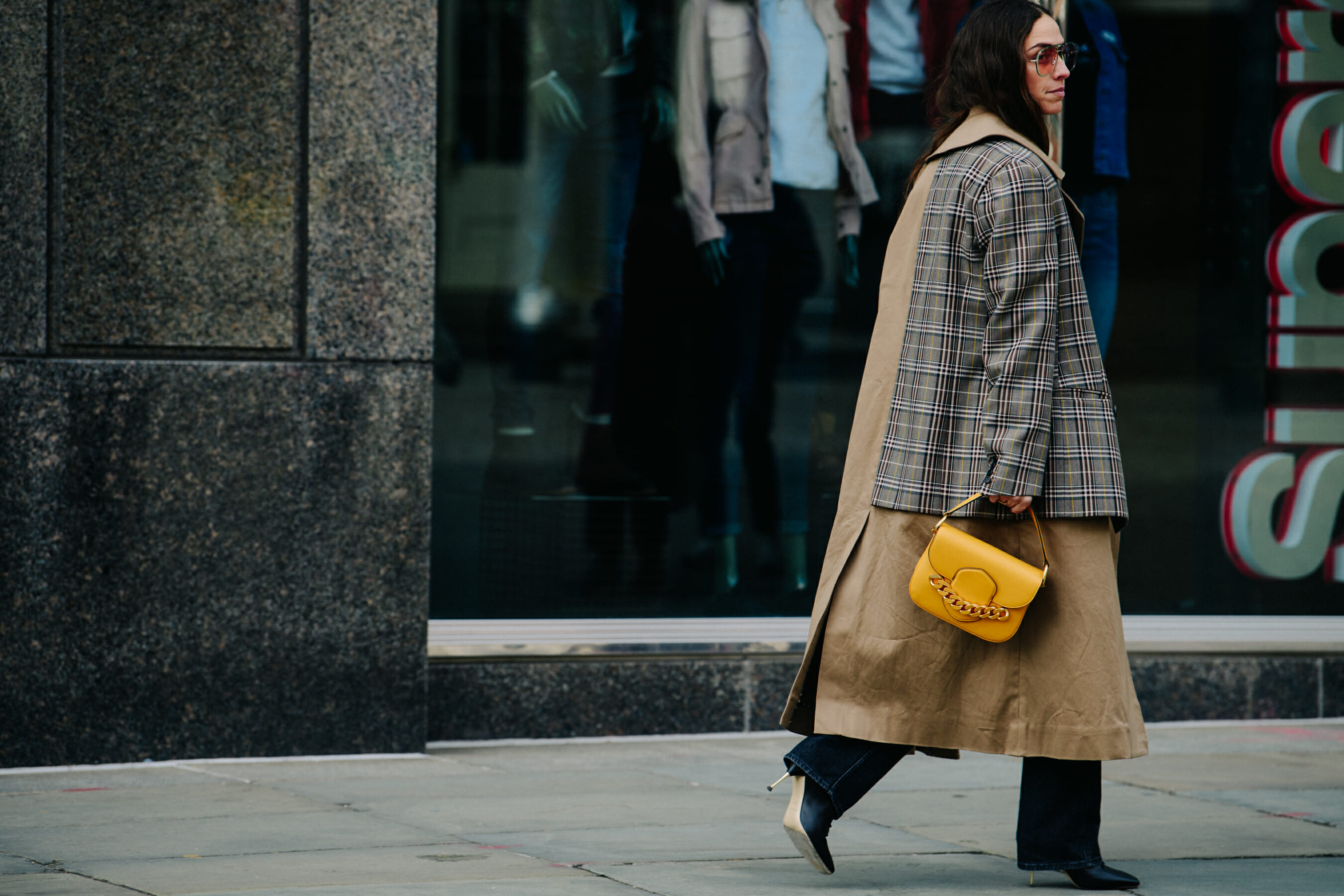 Woman carrying yellow hat