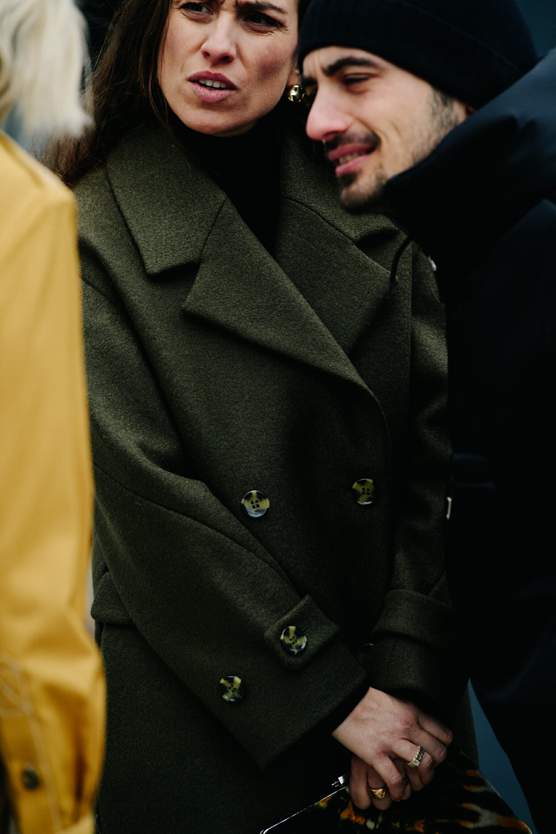 Woman wearing green wool coat