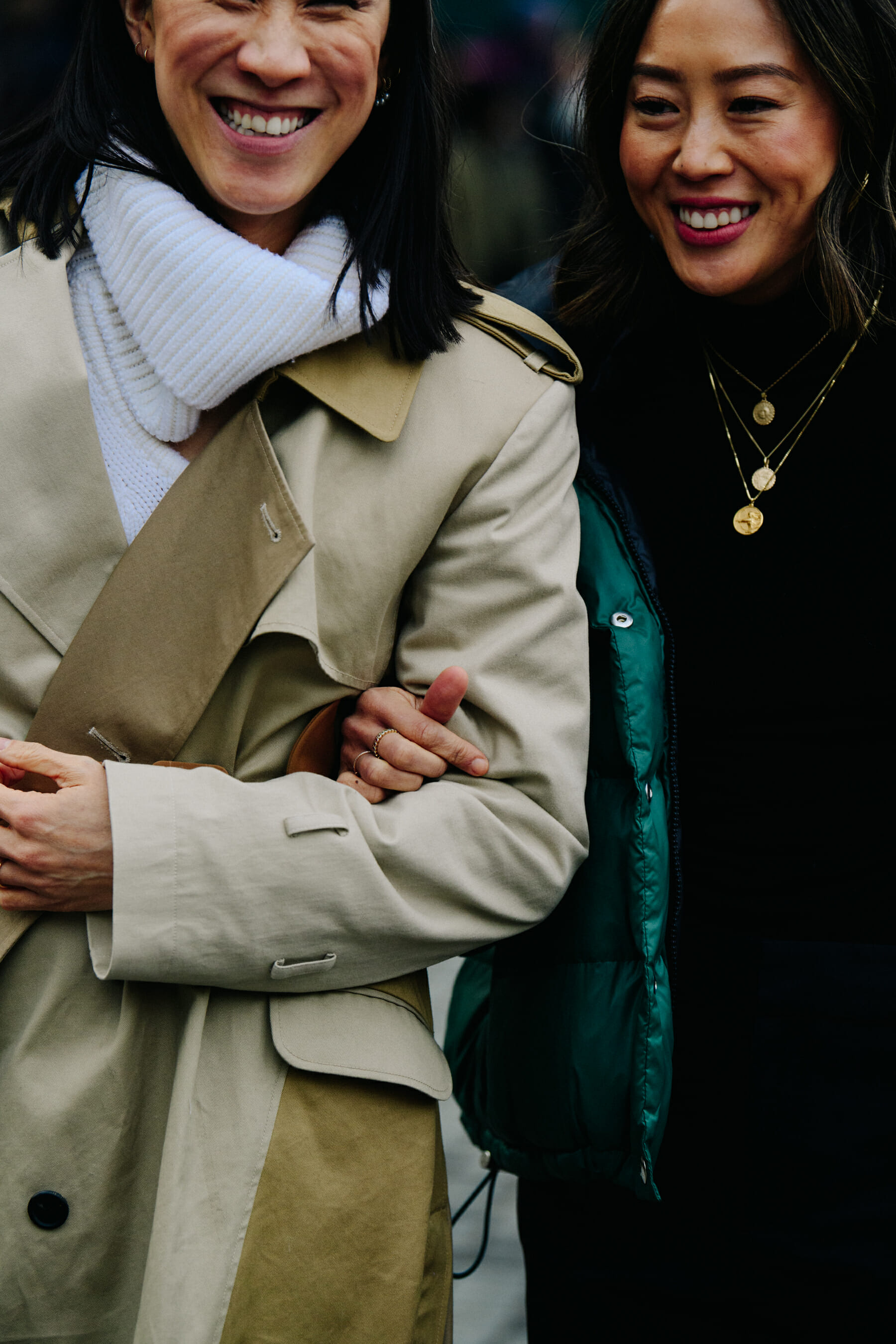 Two women wearing winter coats
