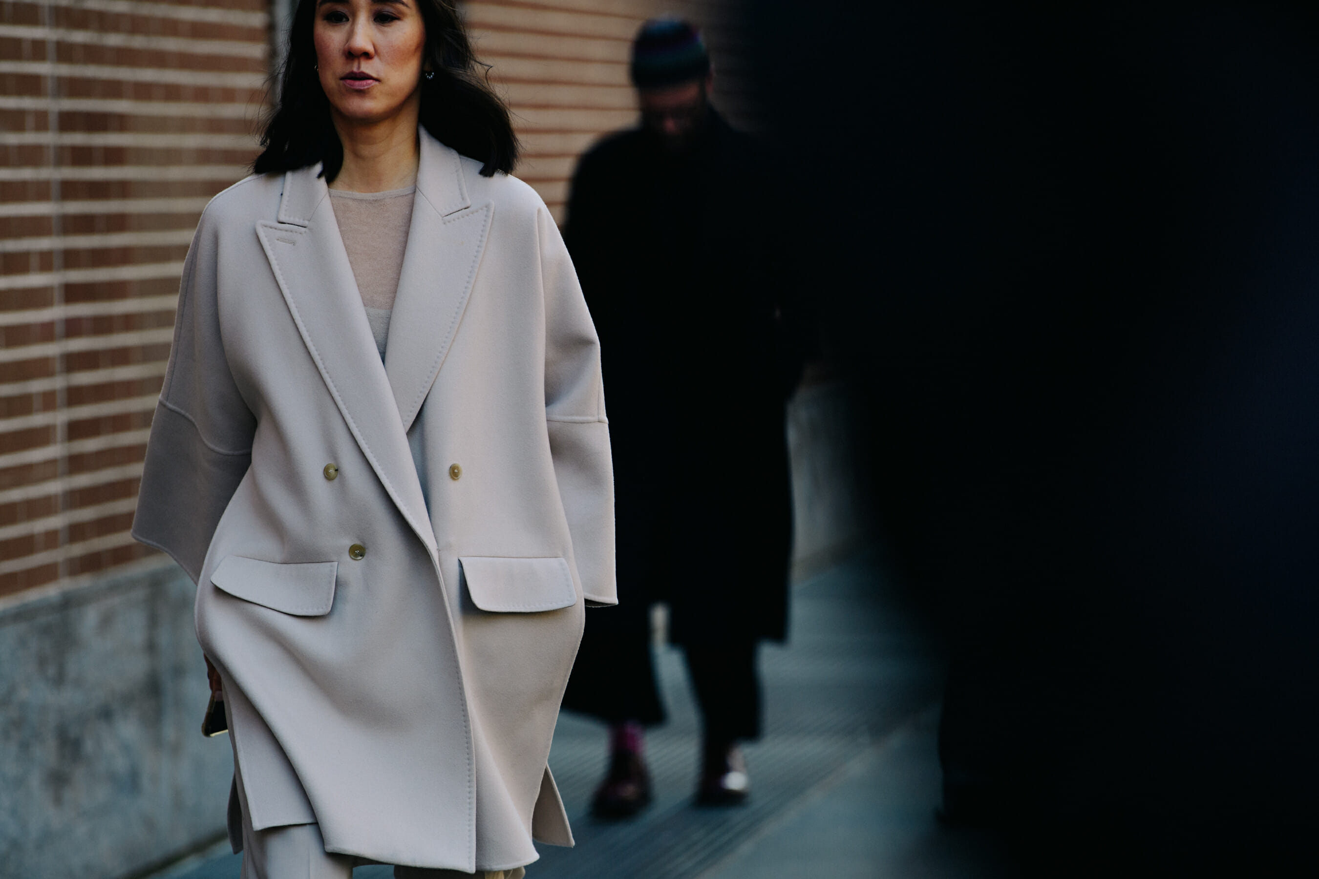Woman wearing light wool coat