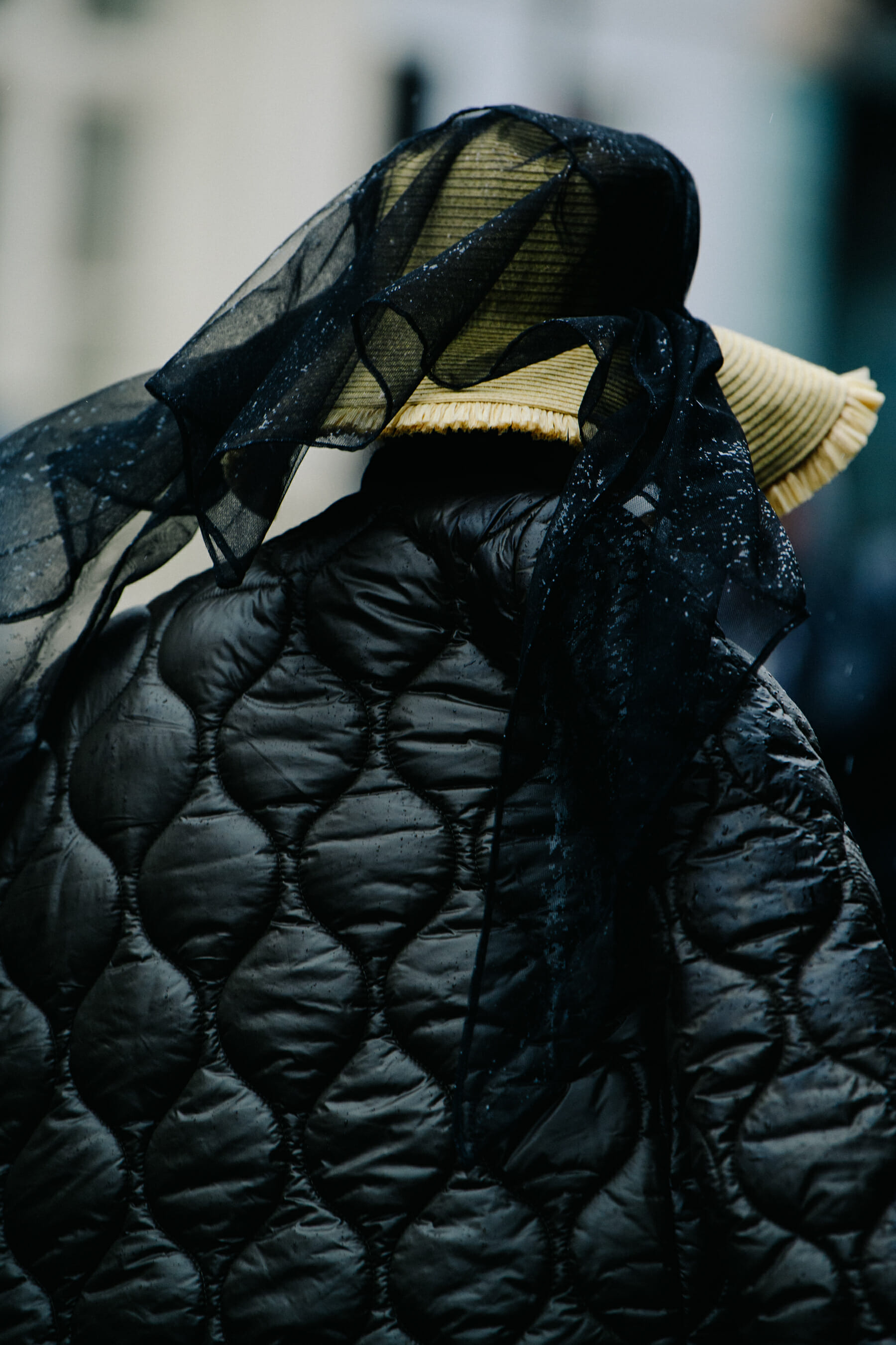 Woman wearing black quilted jacket