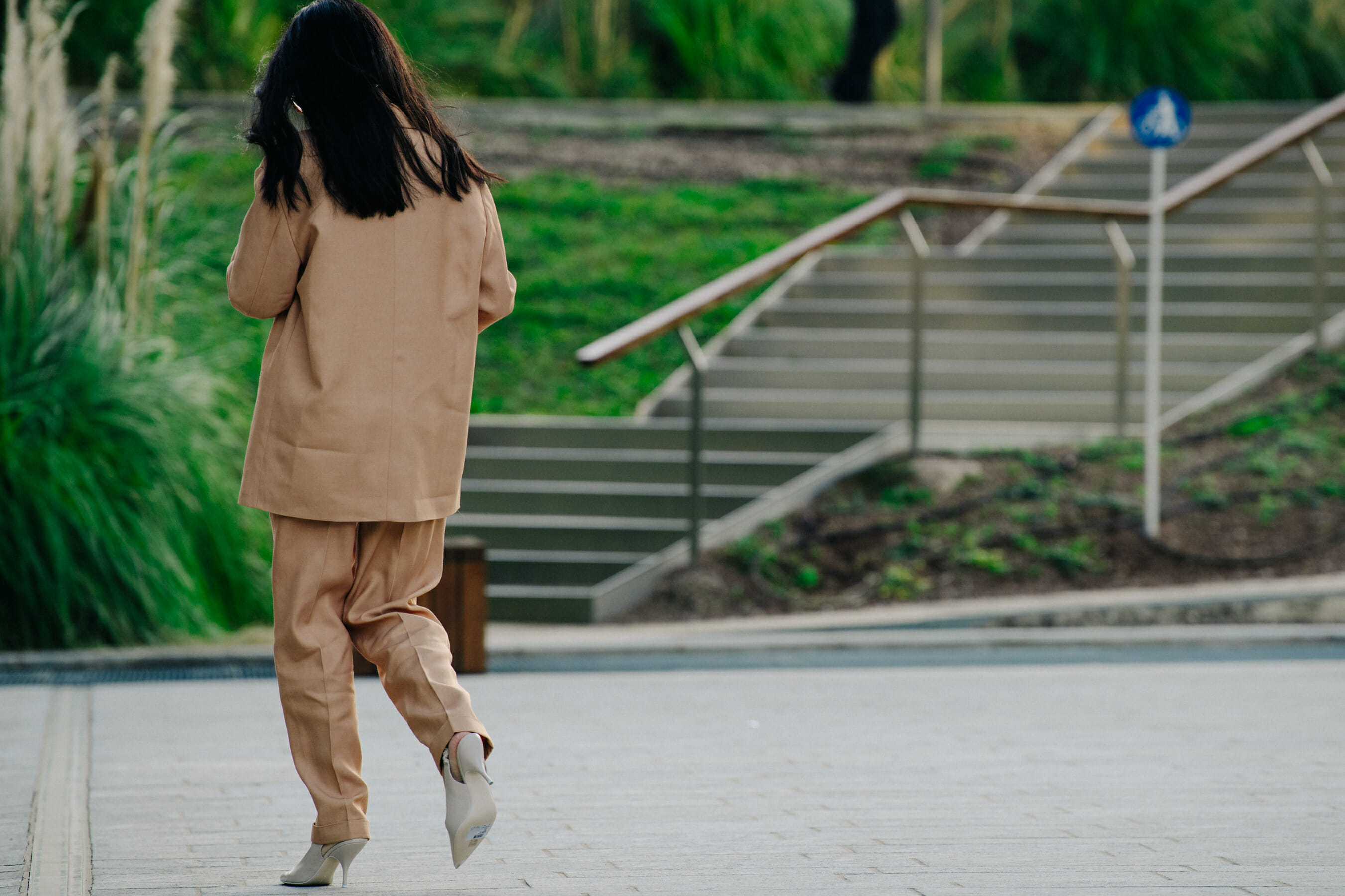 Woman wearing tan suit