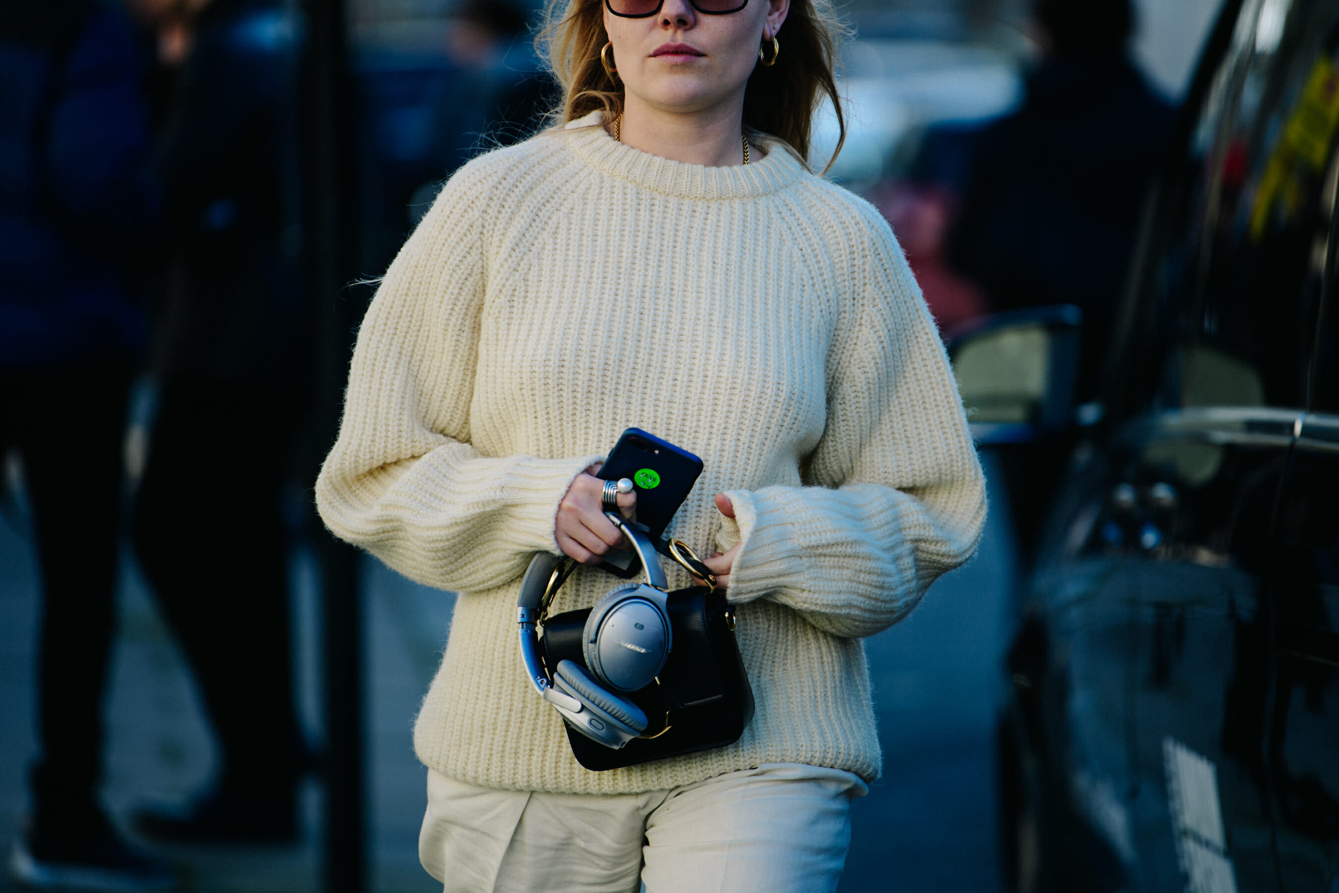 Woman wearing white wool jumper