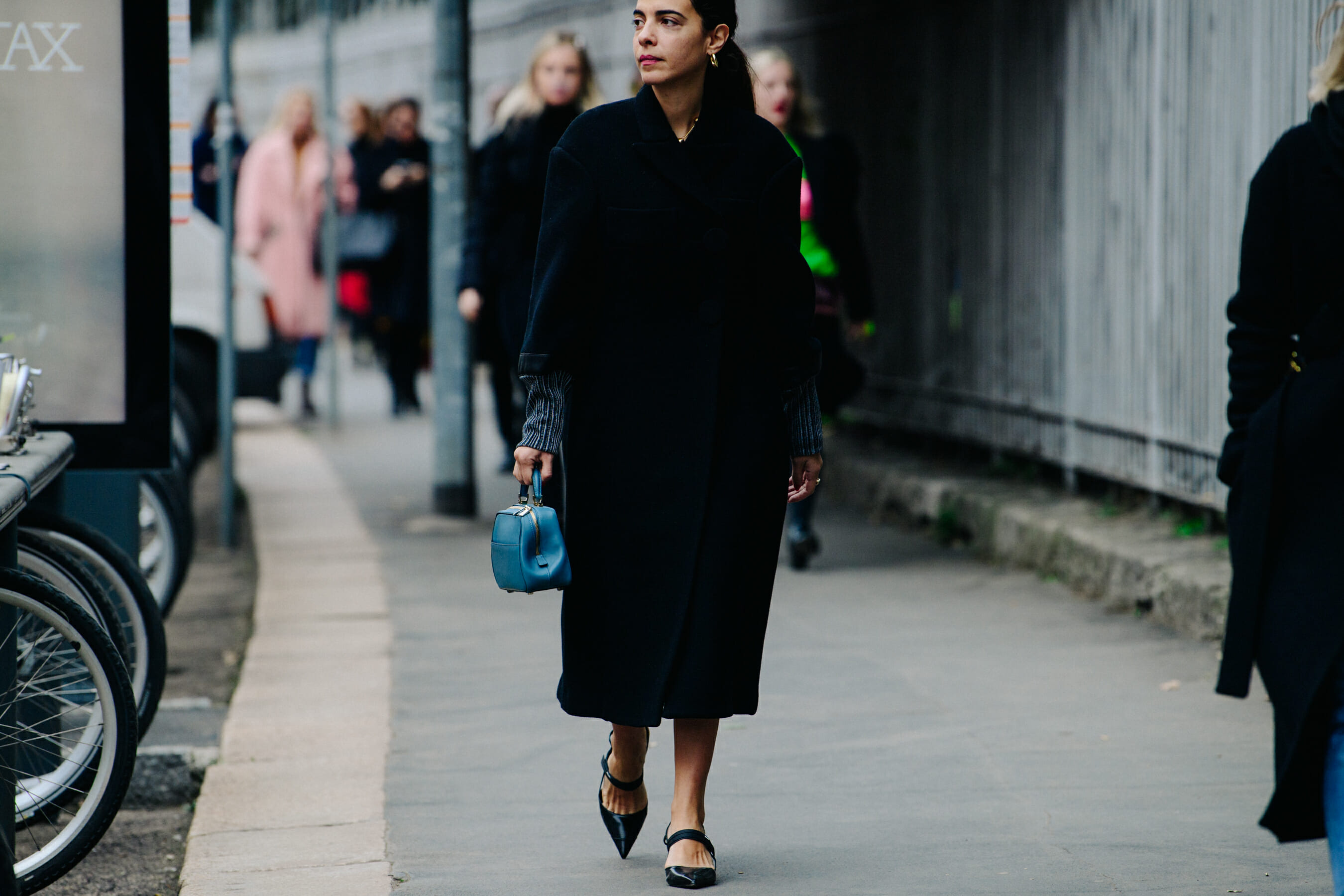 Woman wearing black wool coat
