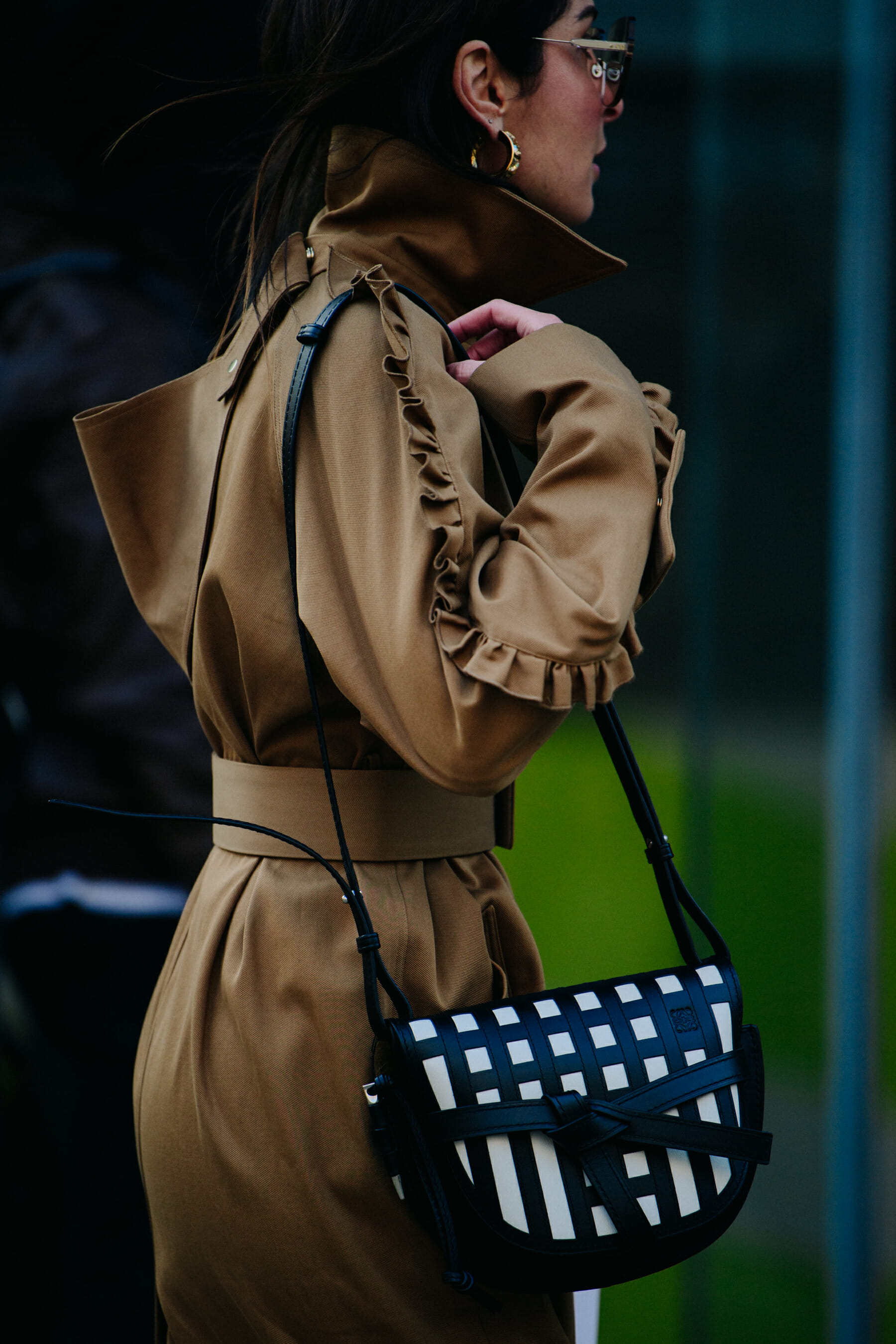 Woman wearing frilled coat