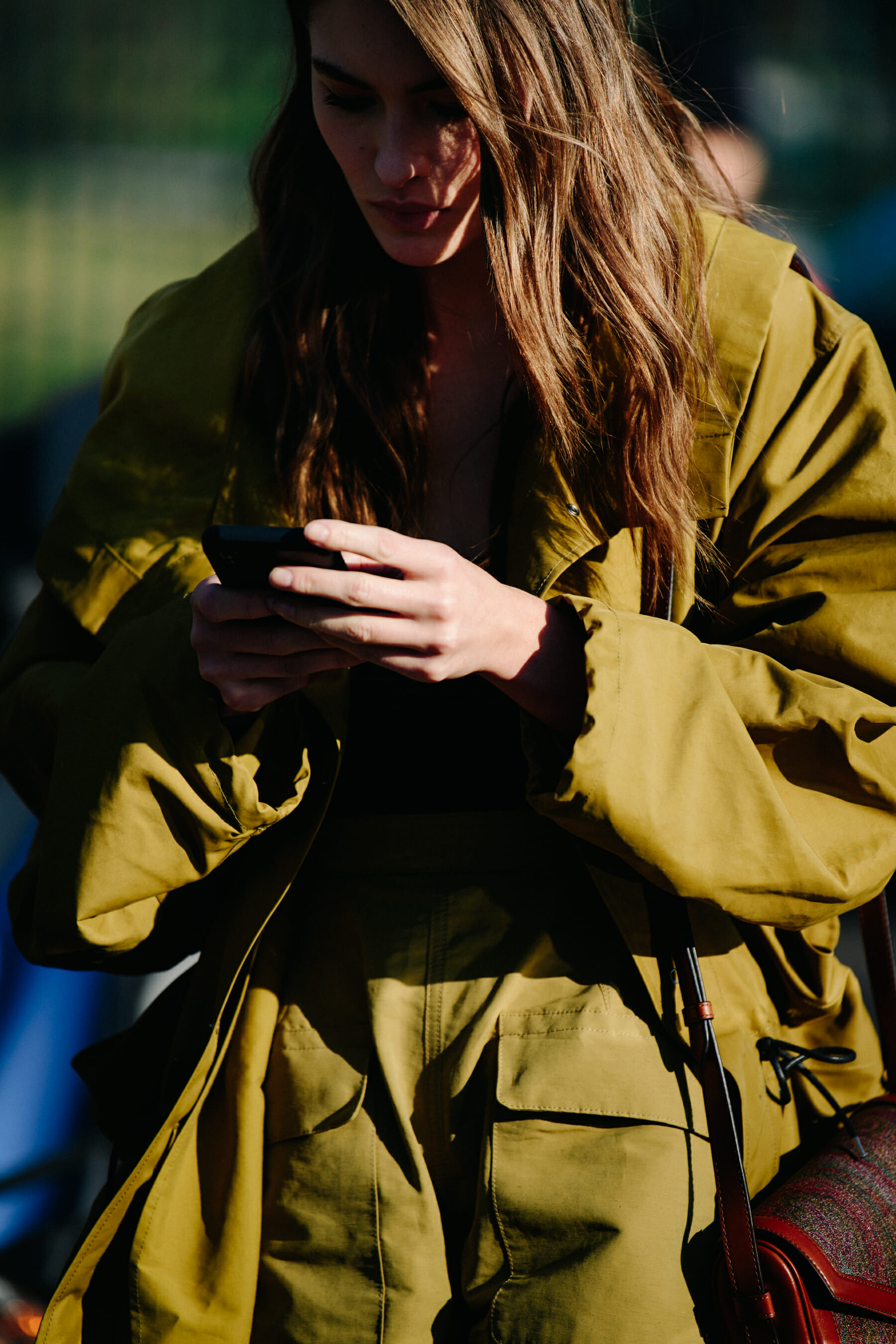 Model wearing green outfit