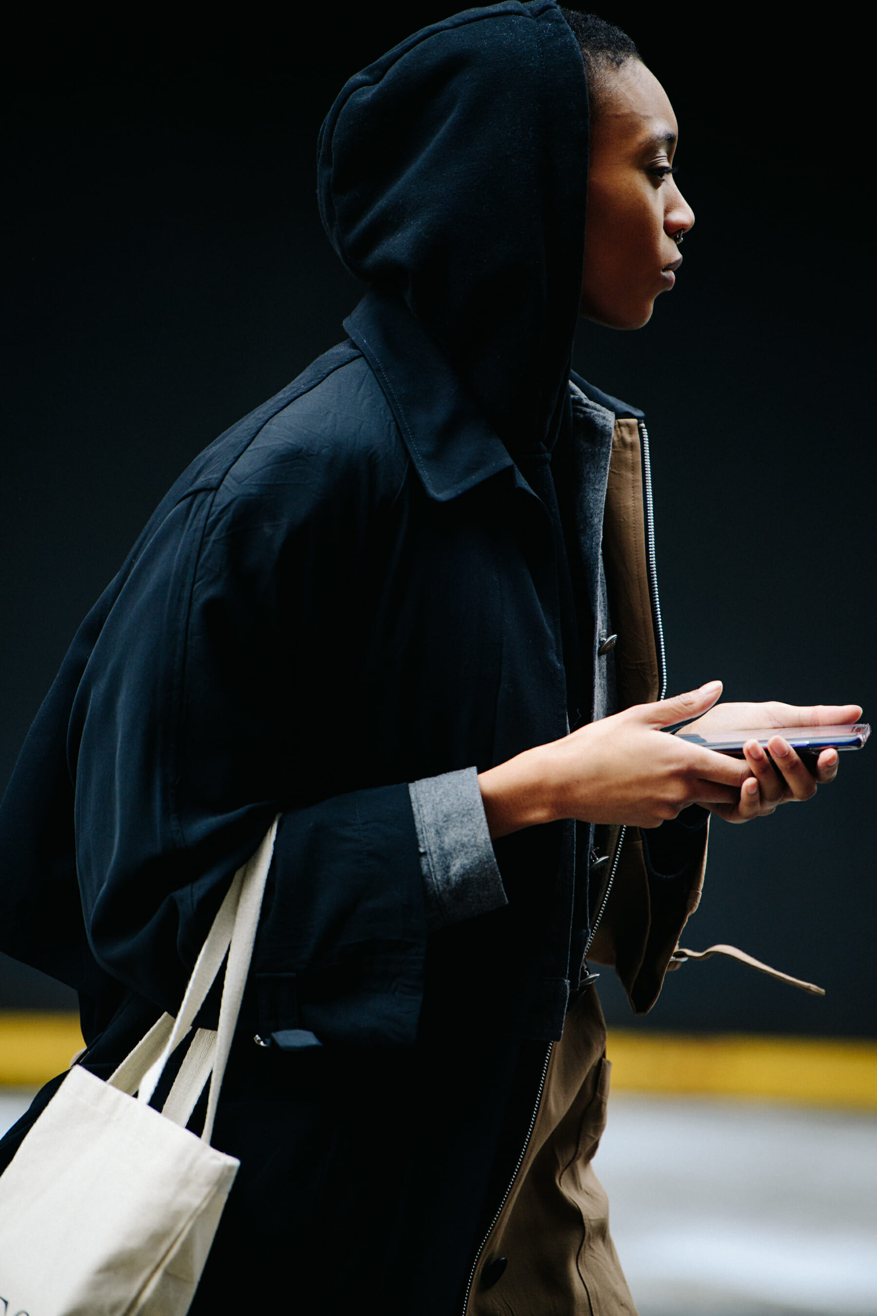 Model wearing black hoodie