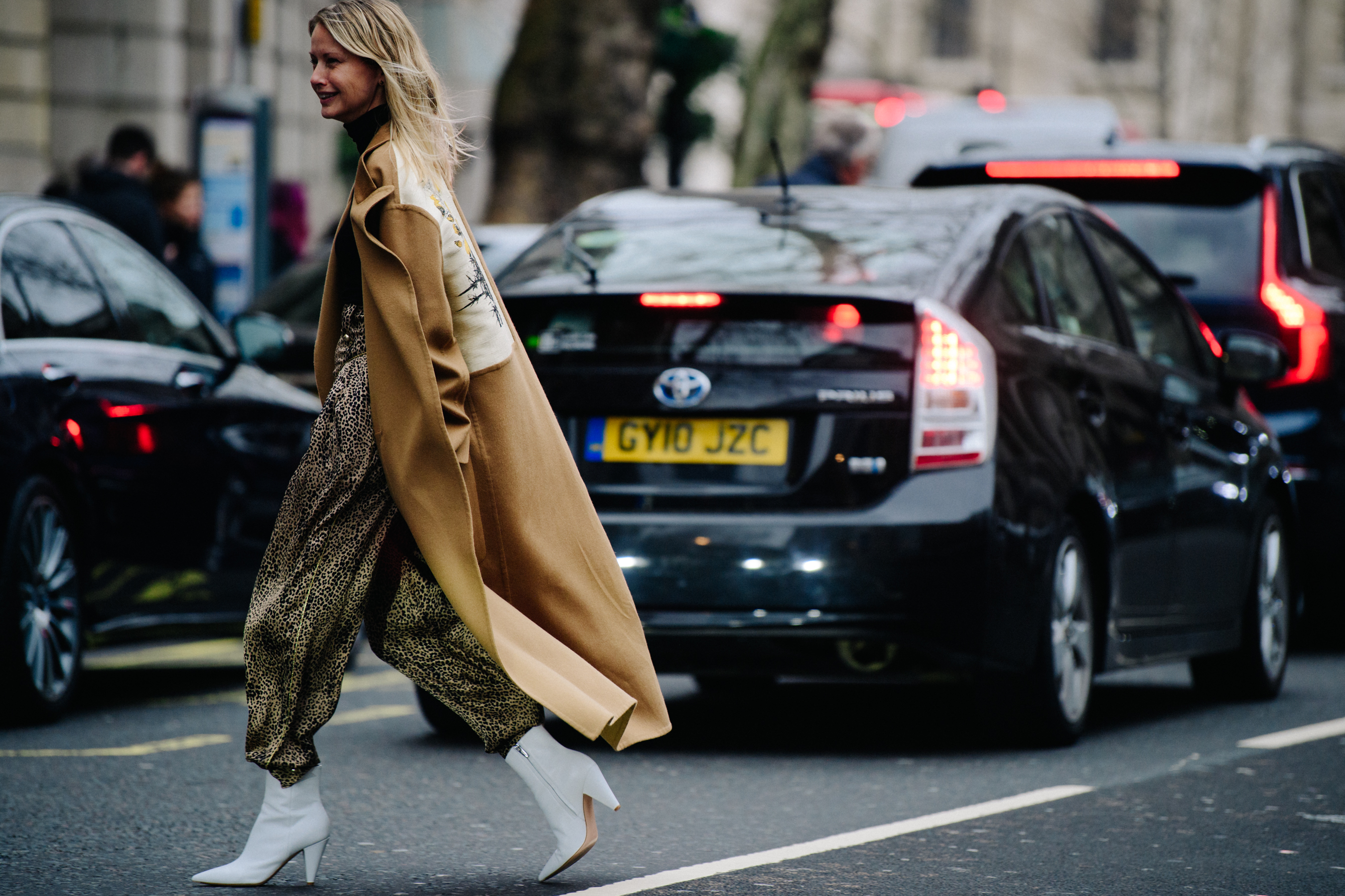 Woman wearing long brown coat