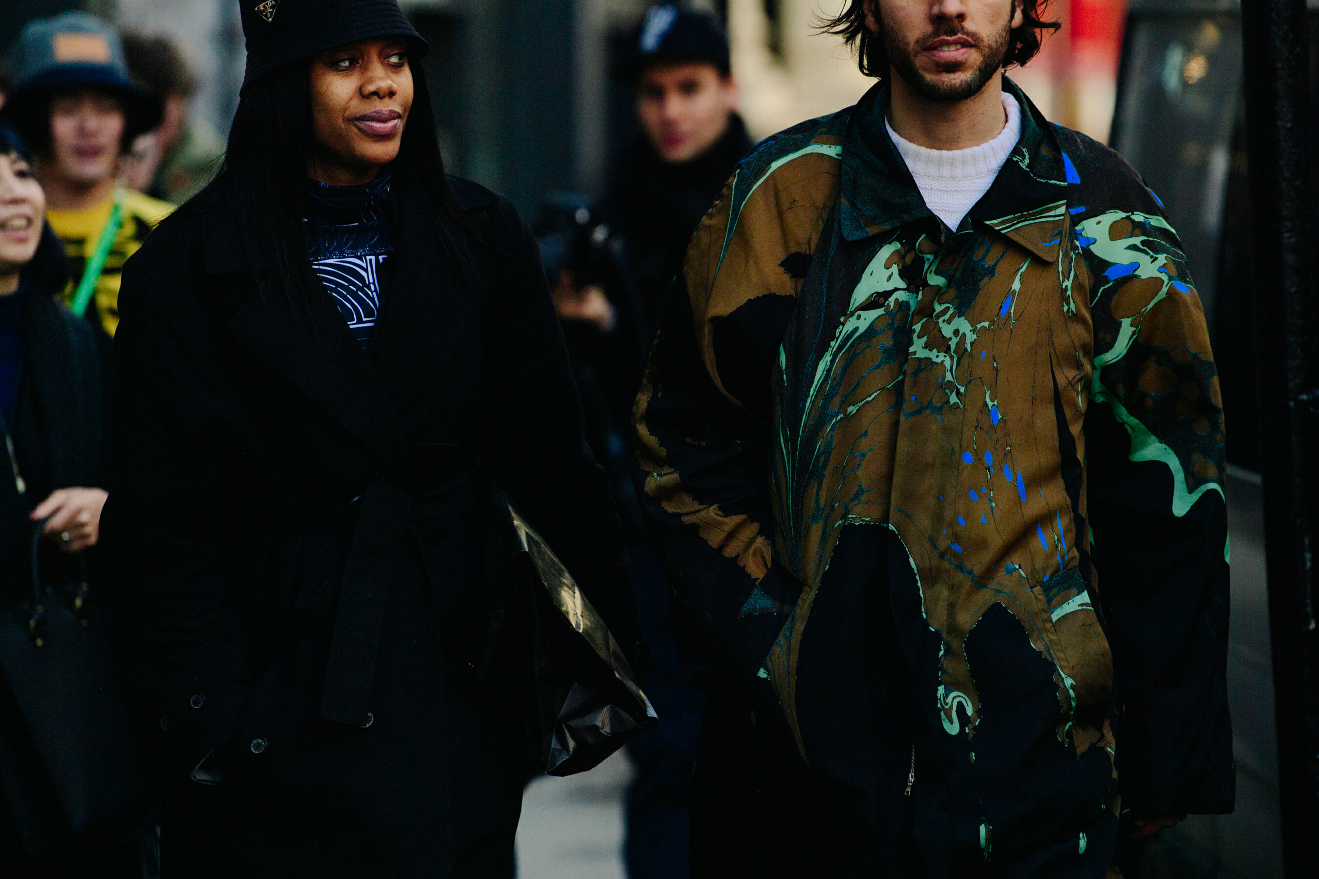 Couple wearing dark outfits