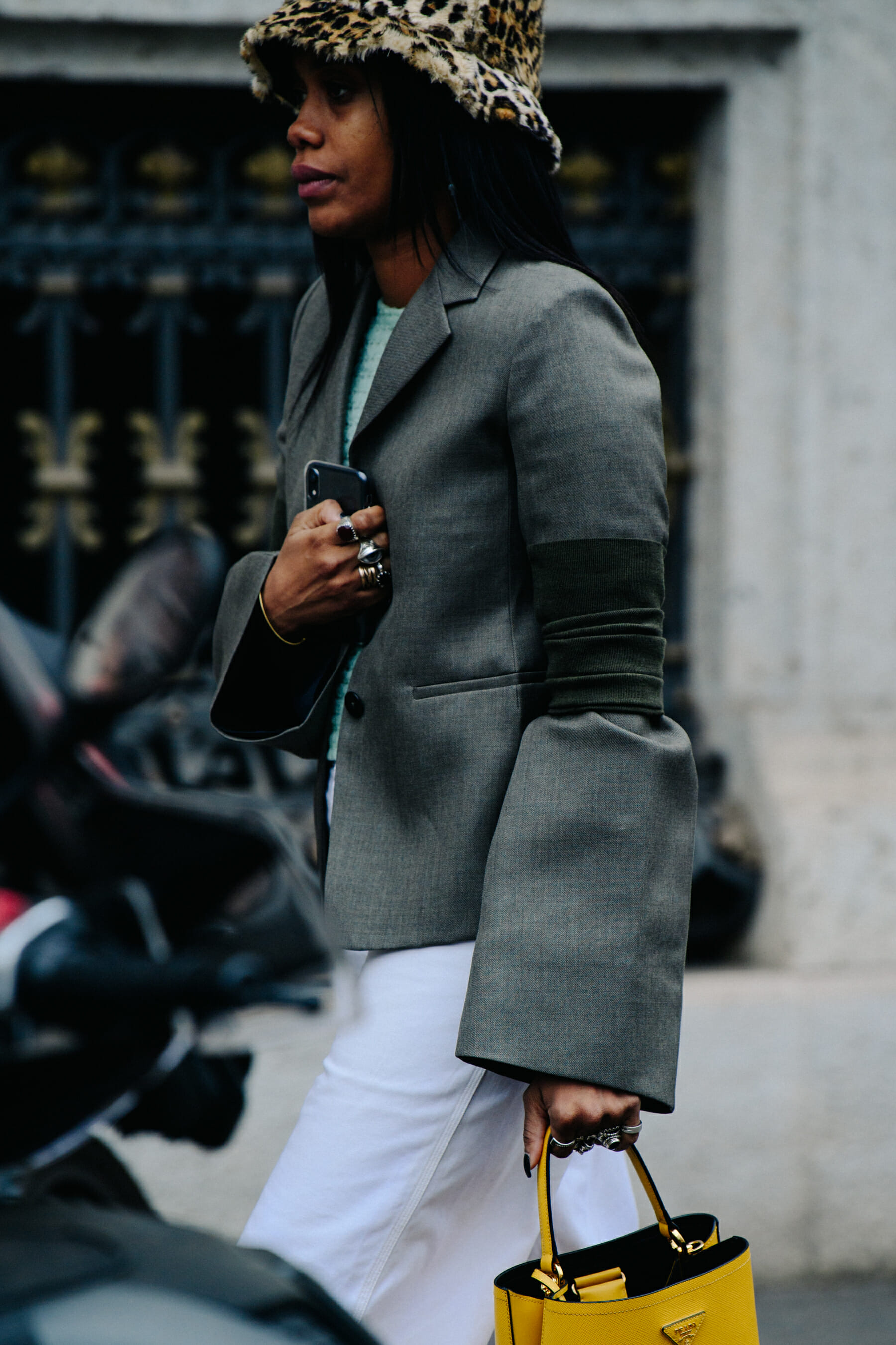 Woman carrying yellow Prada bag