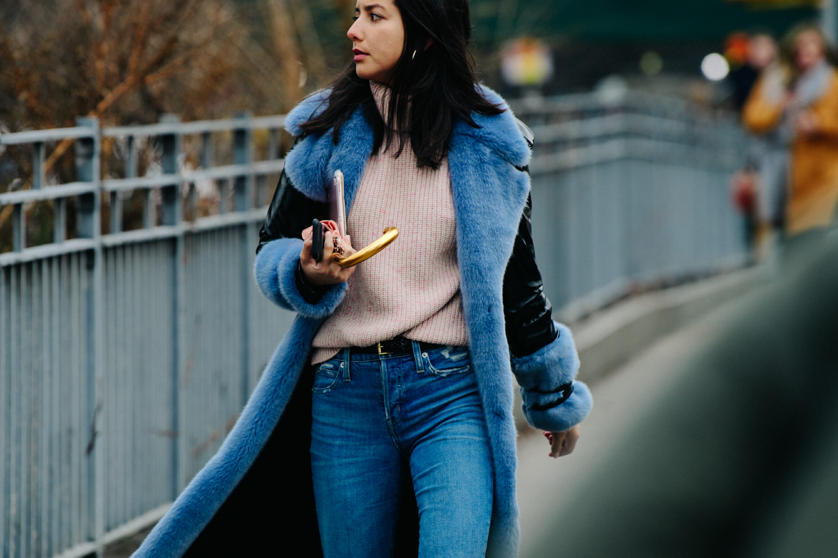 Woman wearing blue fur trim coat