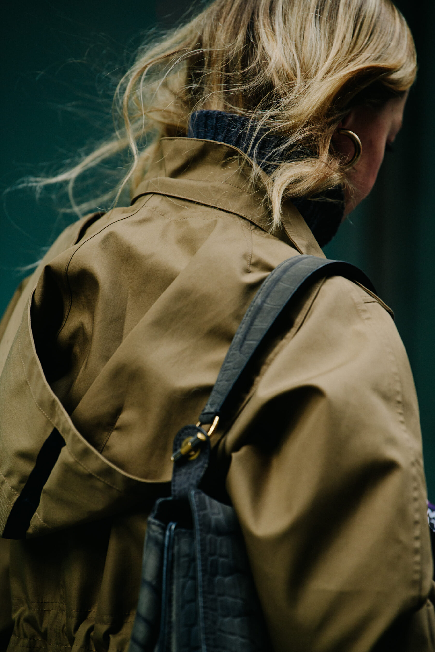 Woman wearing tan coat