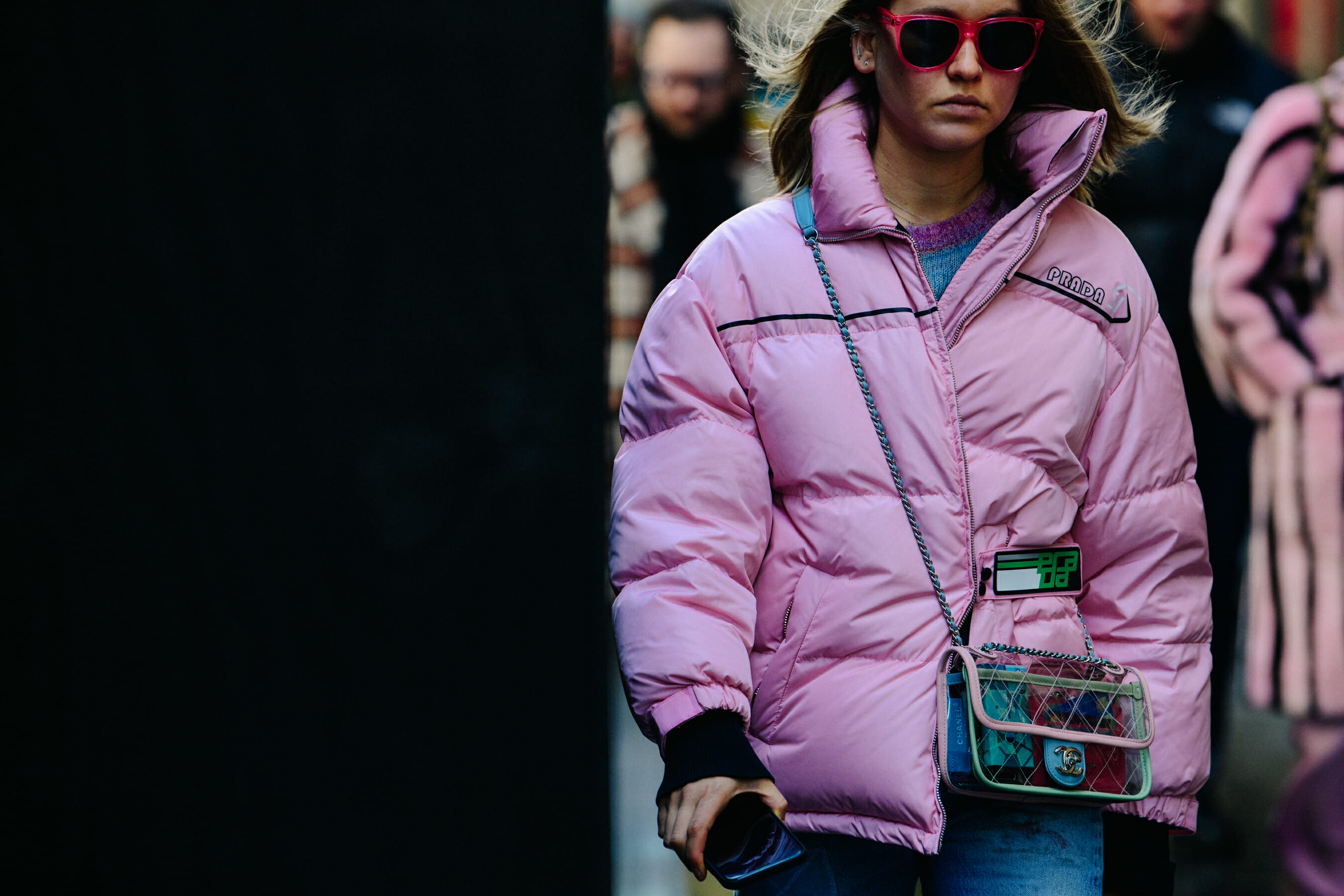 Woman wearing pink Prada coat
