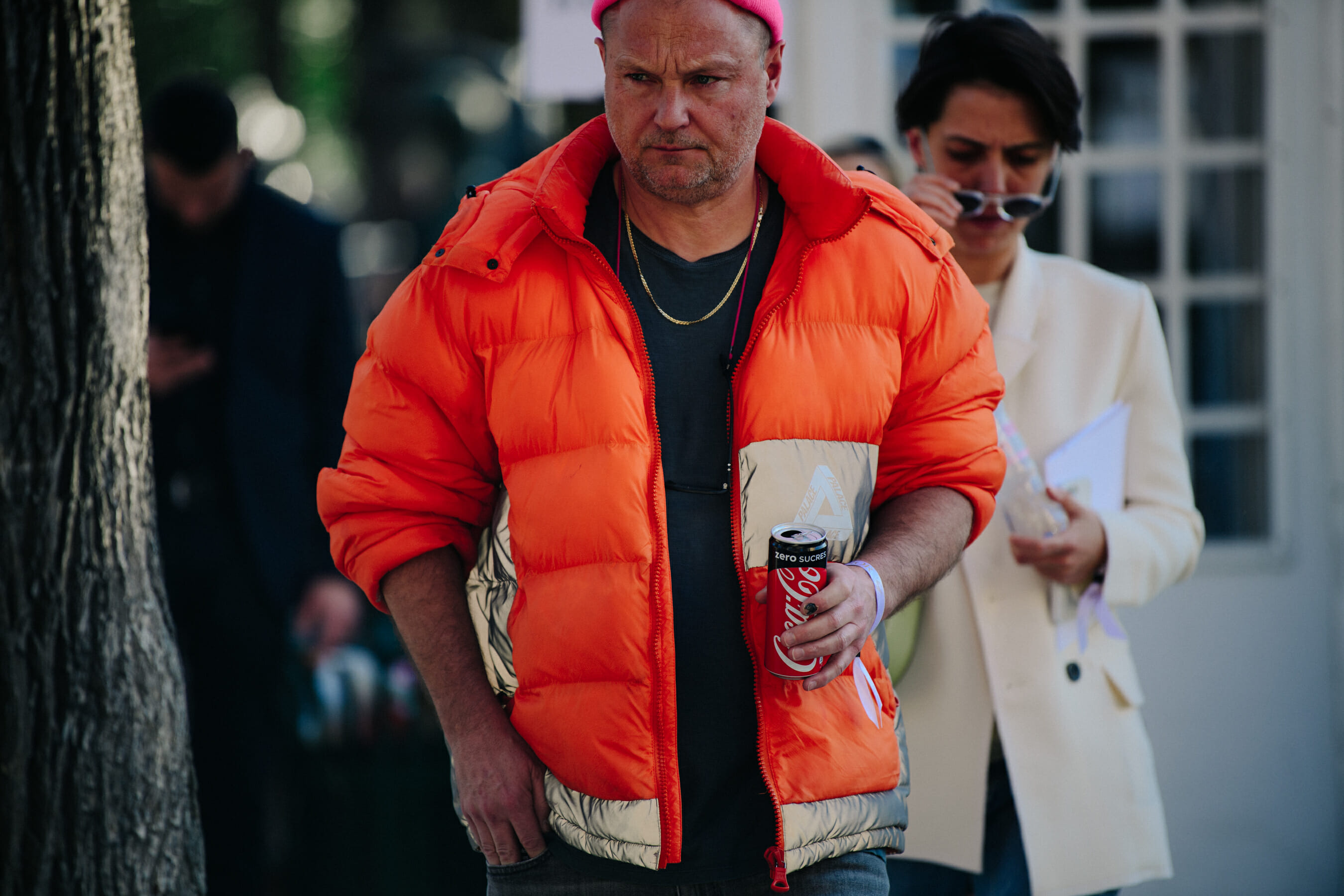 Photographer wearing orange jacket